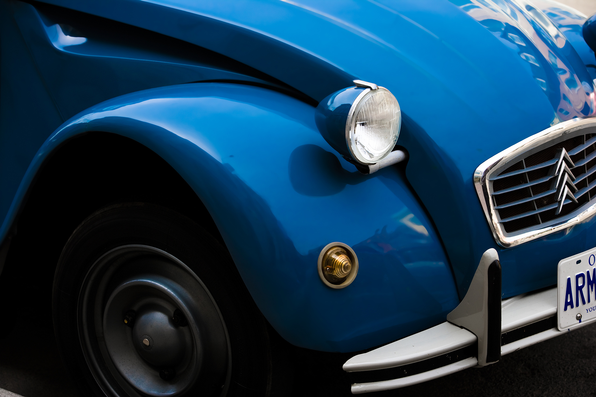 fender of restored classic car outdoors