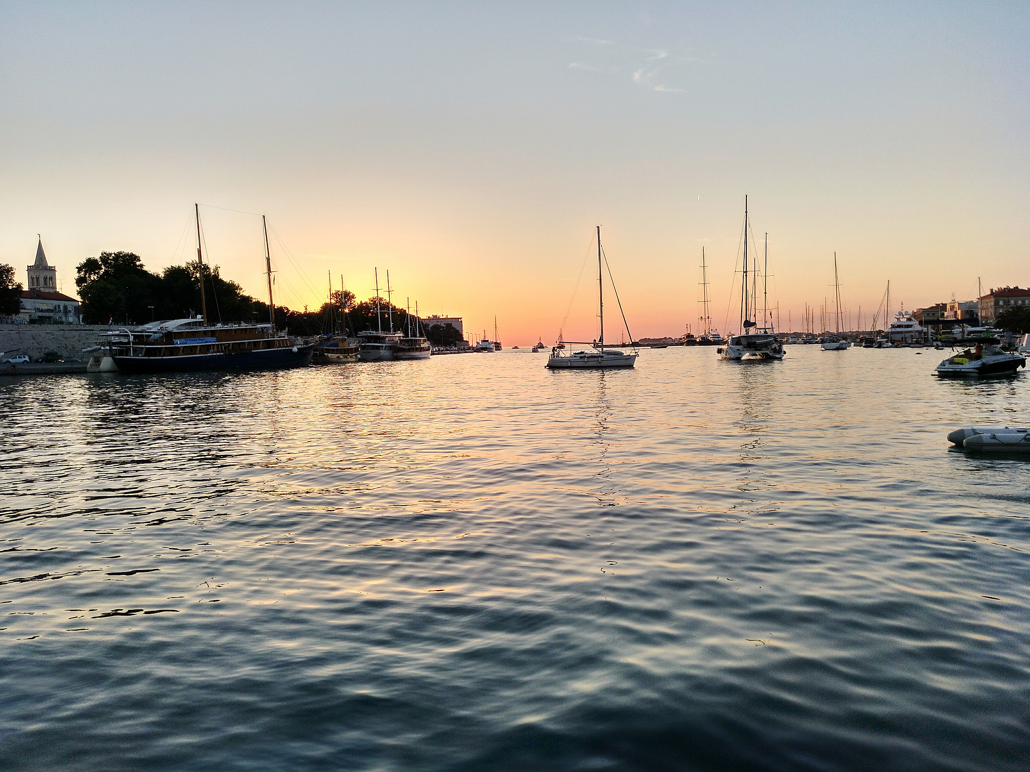 sailboats moored on sea