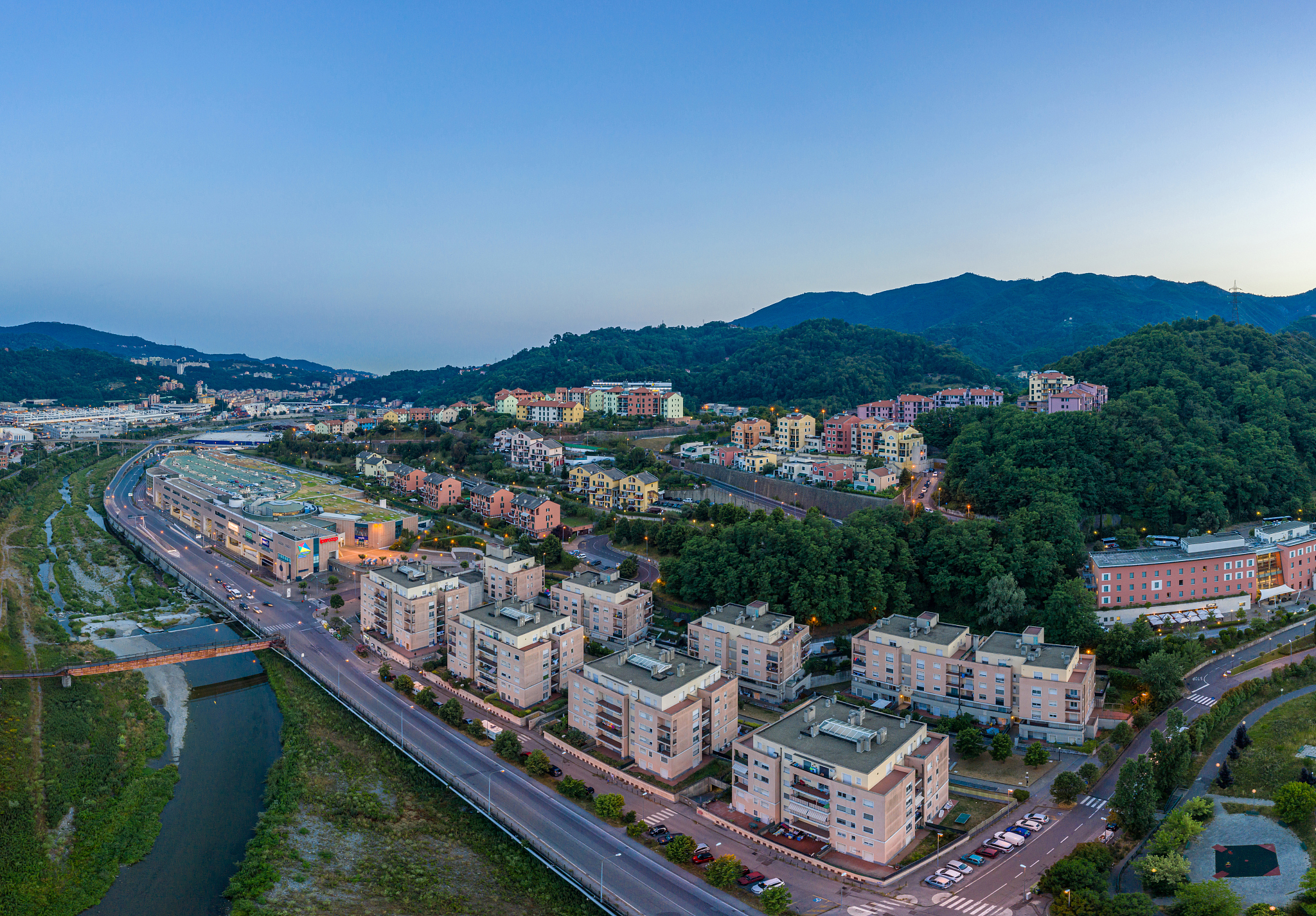 aerial view of genoa city townscape in summer evening, italy