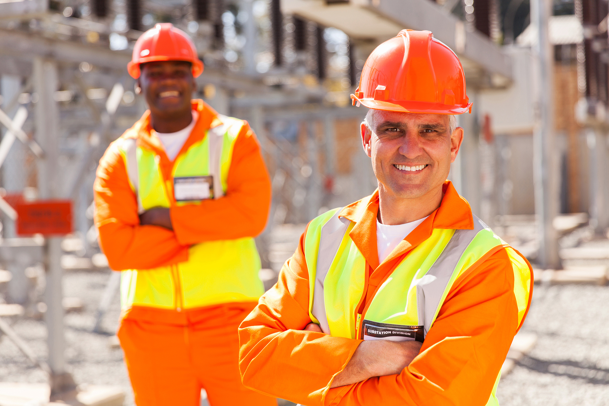 two electricity company workers
