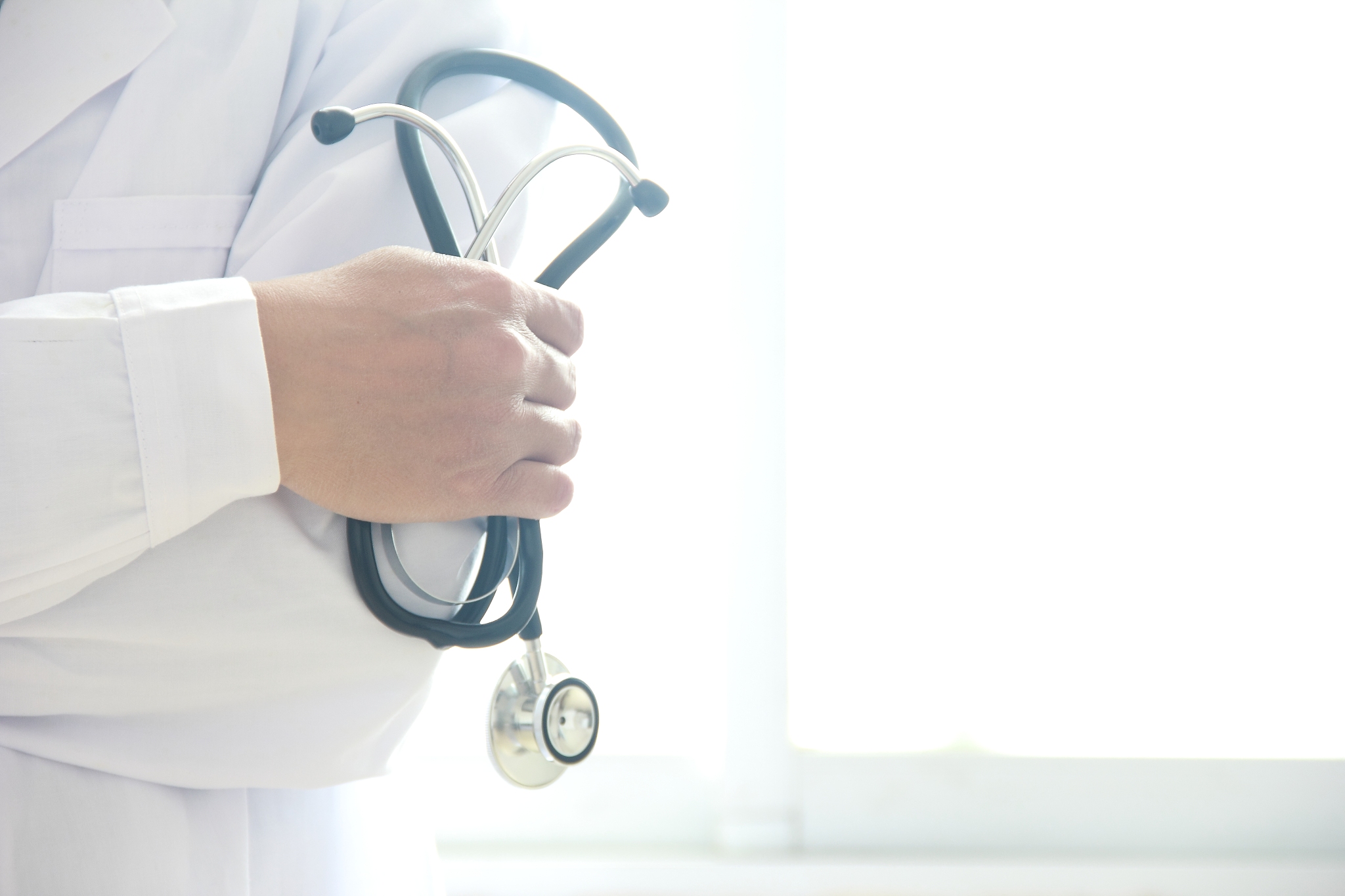 doctor hand holding stethoscope