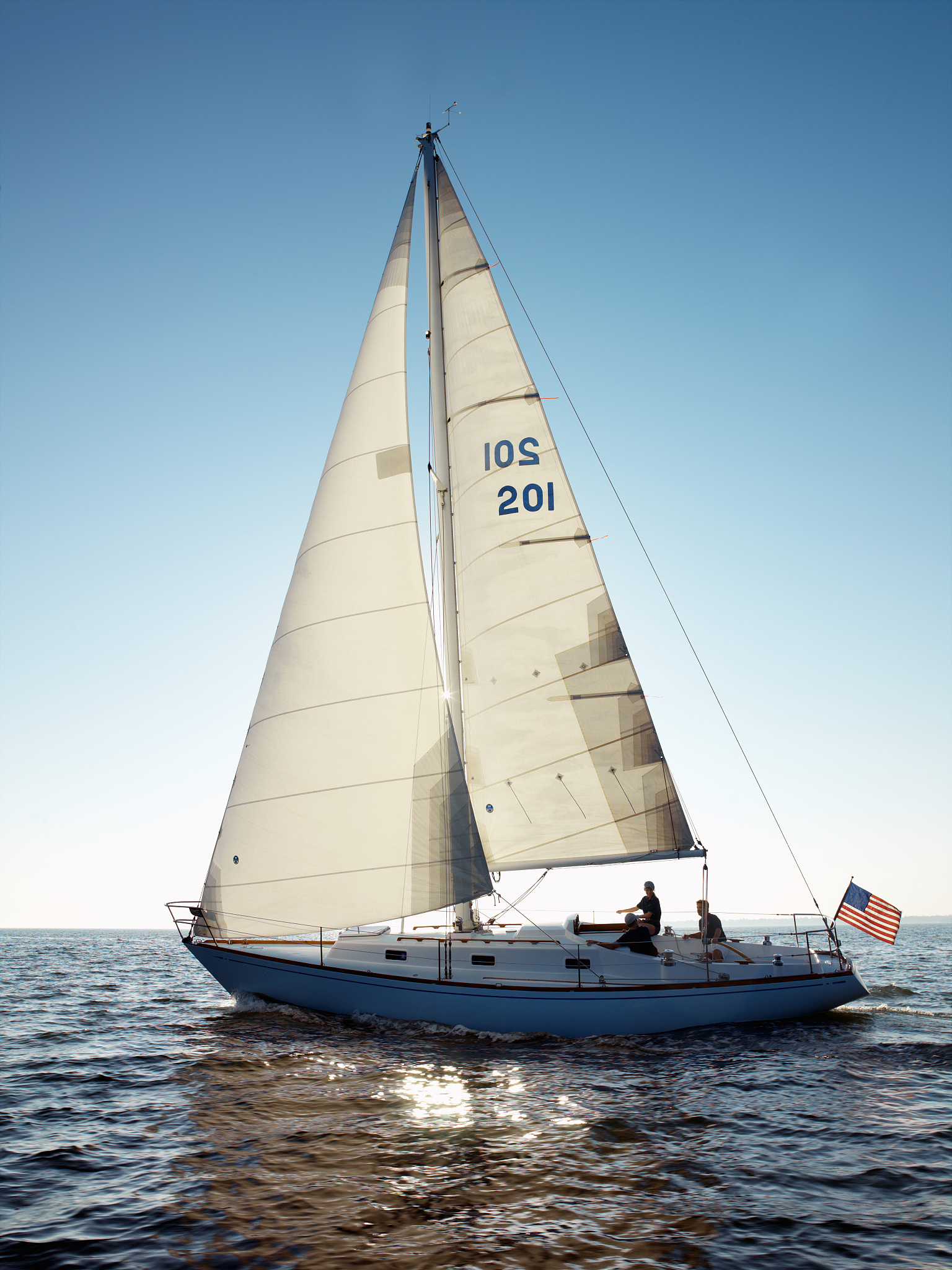 people on sailboat, side view
