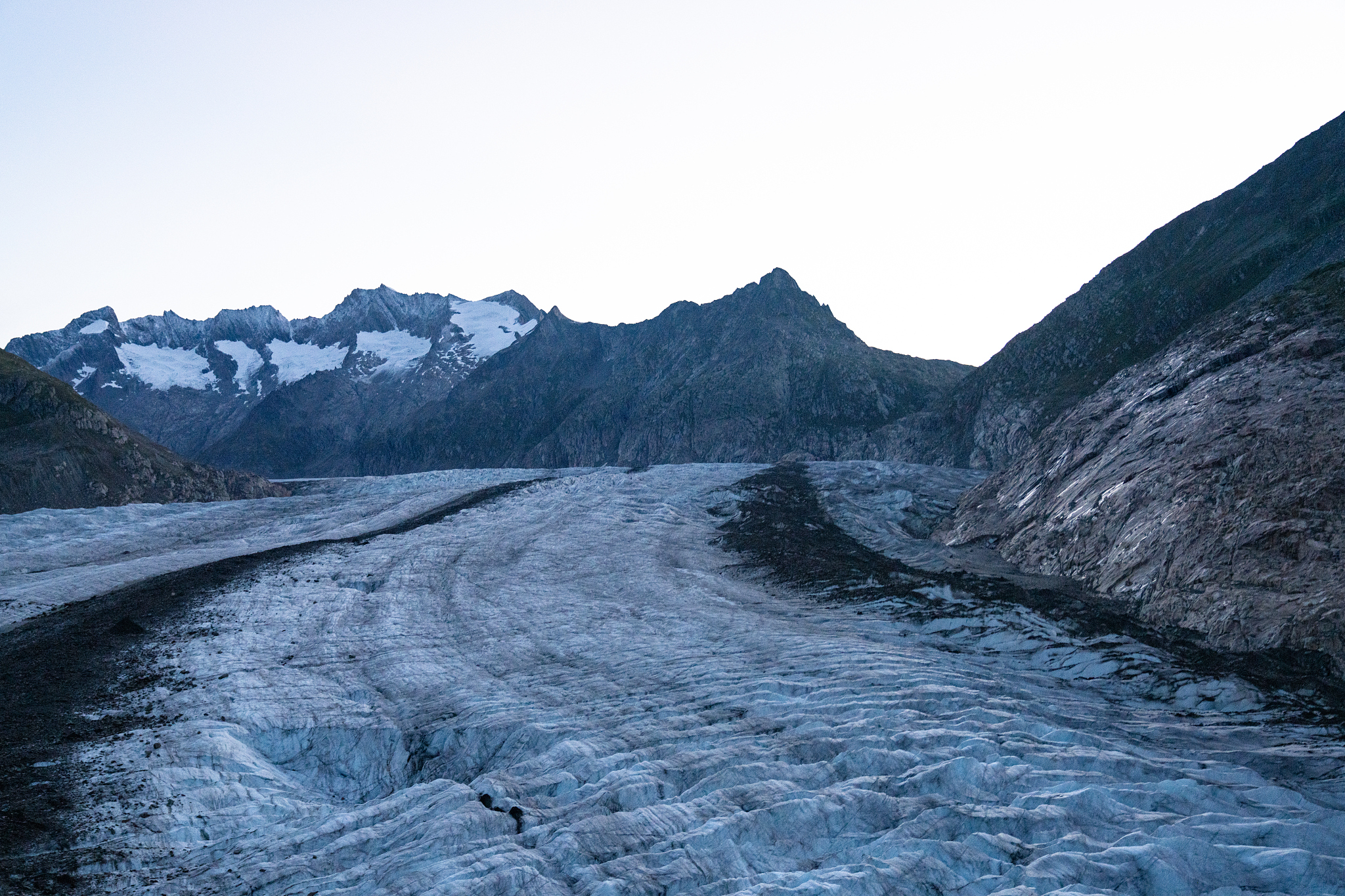 aerial flying low over aletsch glacier in switzerland at sunrise