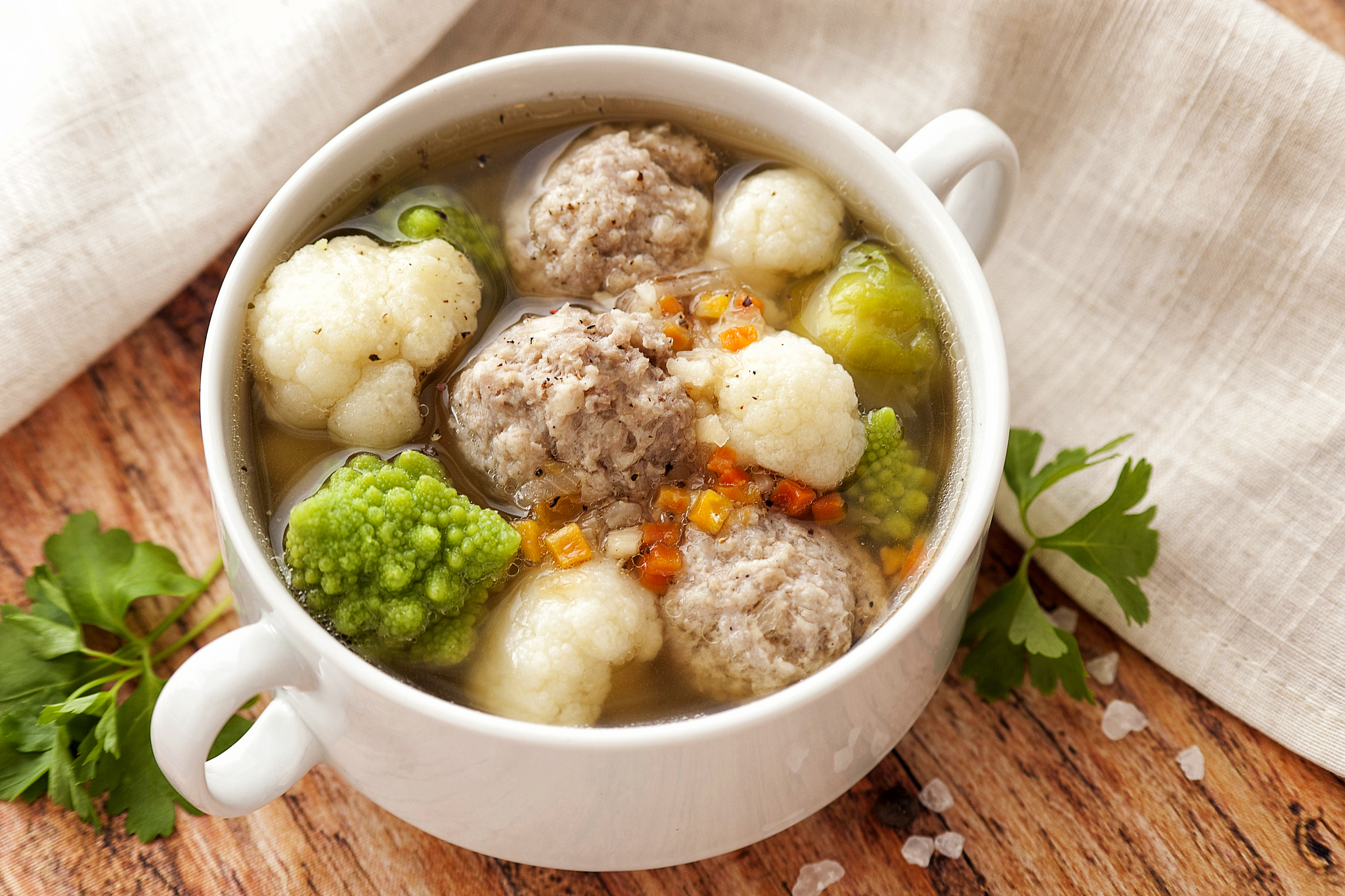 hot thick soup with meatballs and cabbage mix.