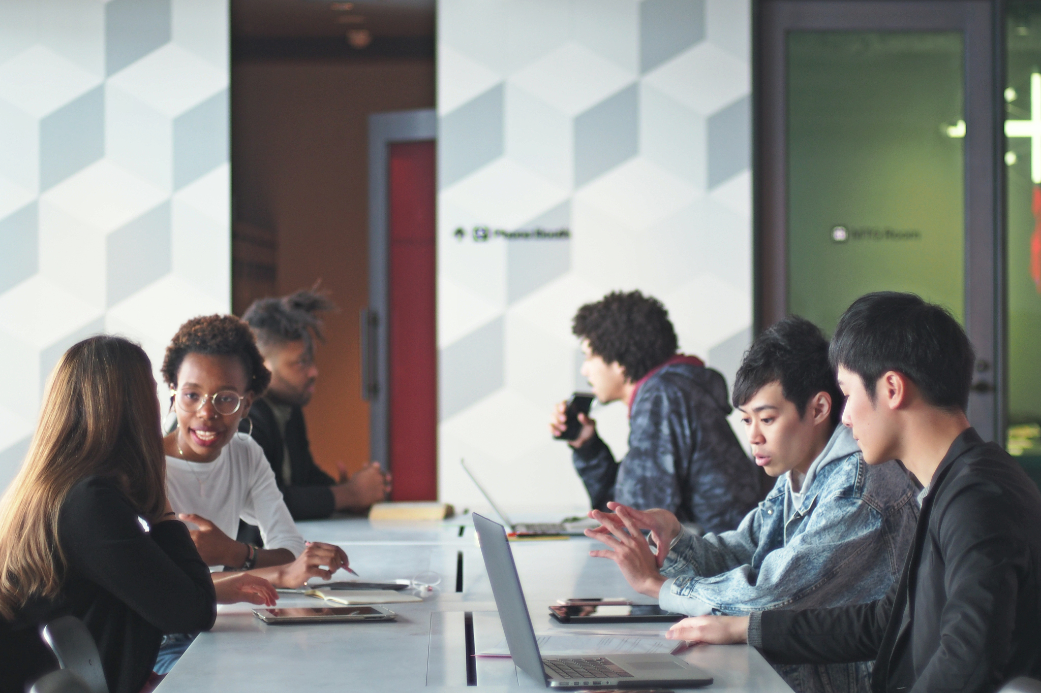various ethnic young people working in a modern share office