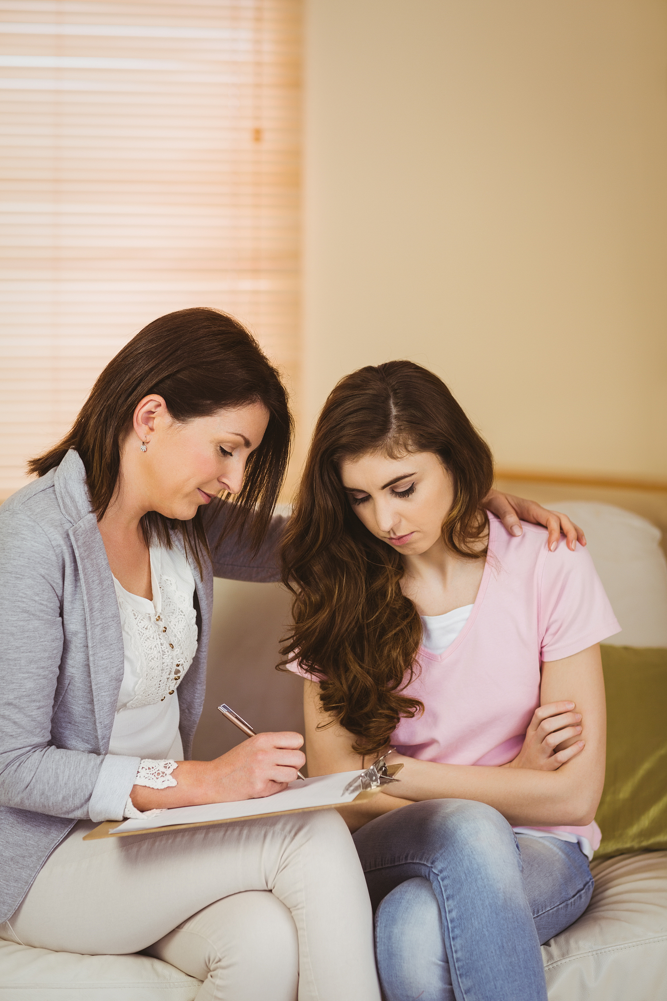 therapist listening to her upset patient