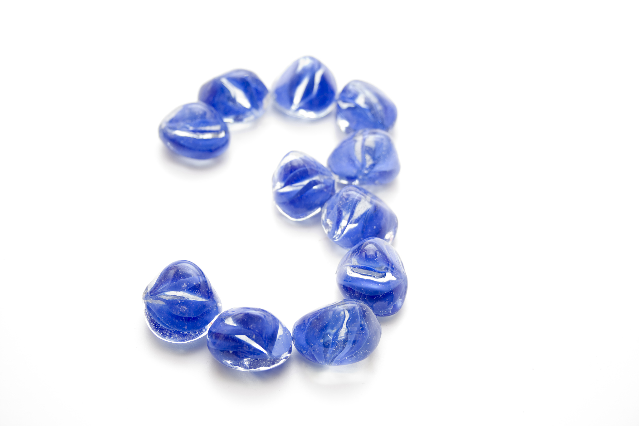 three of blue glass stones