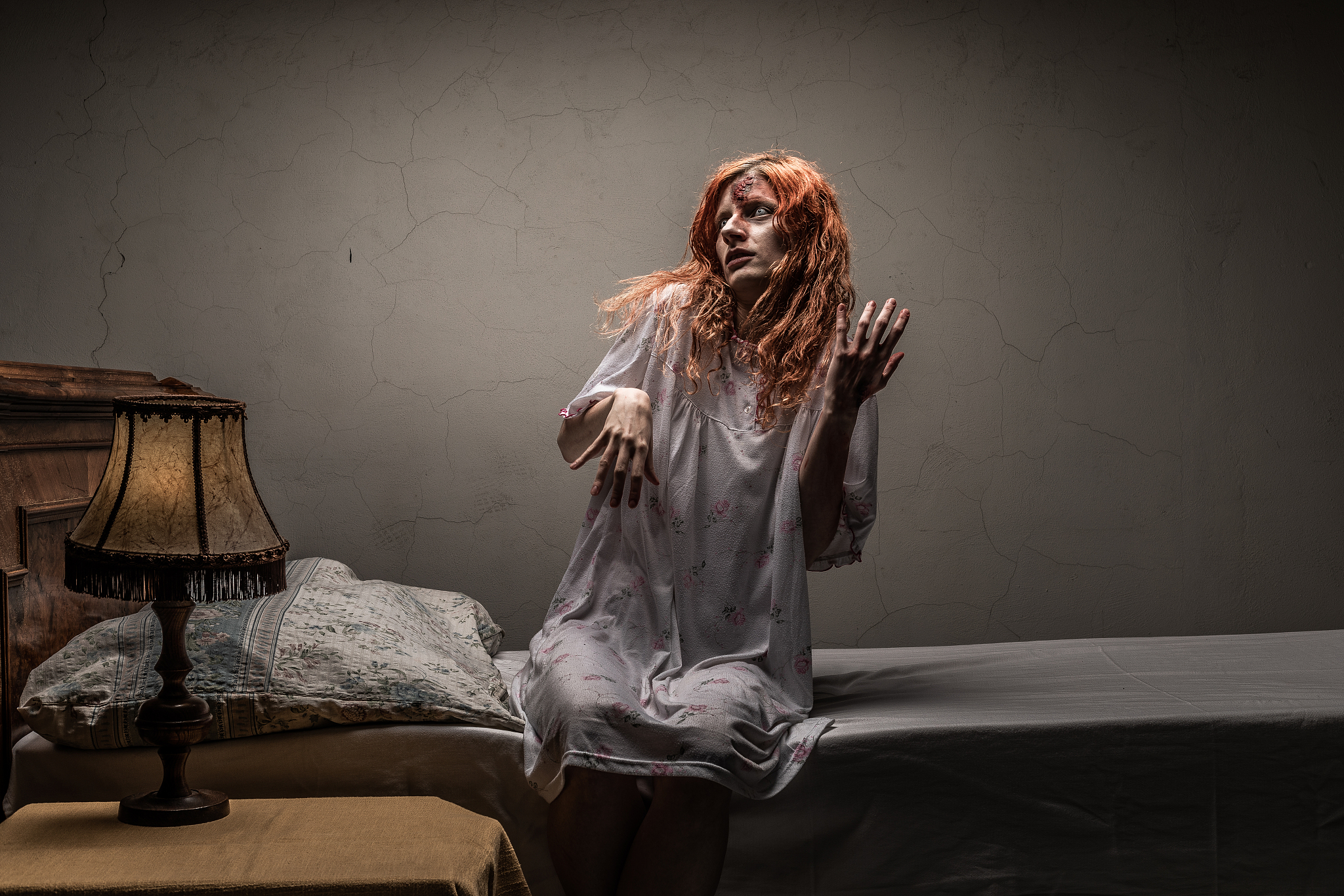 scary woman possessed by devil in the bed. exorcism of priest.