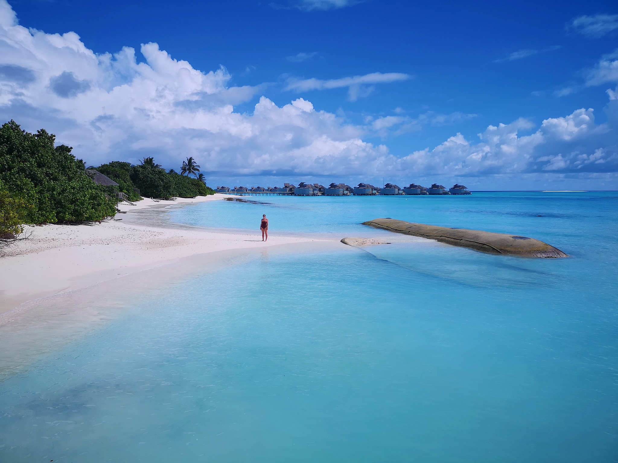 high angle view of woman at beach against blue sky