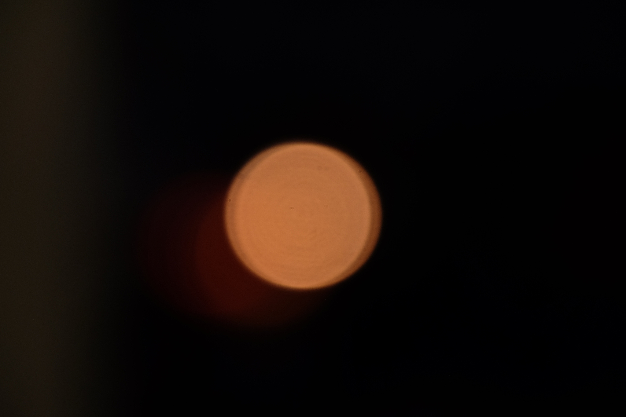 defocused image of illuminated light at night