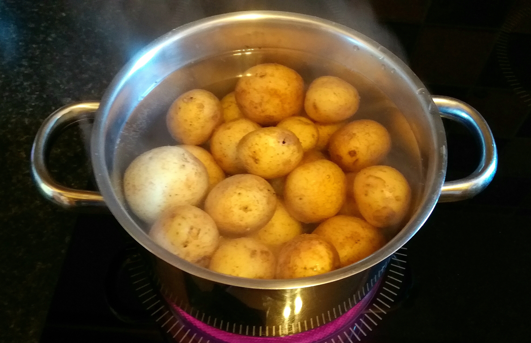 potatoes boiling in pan