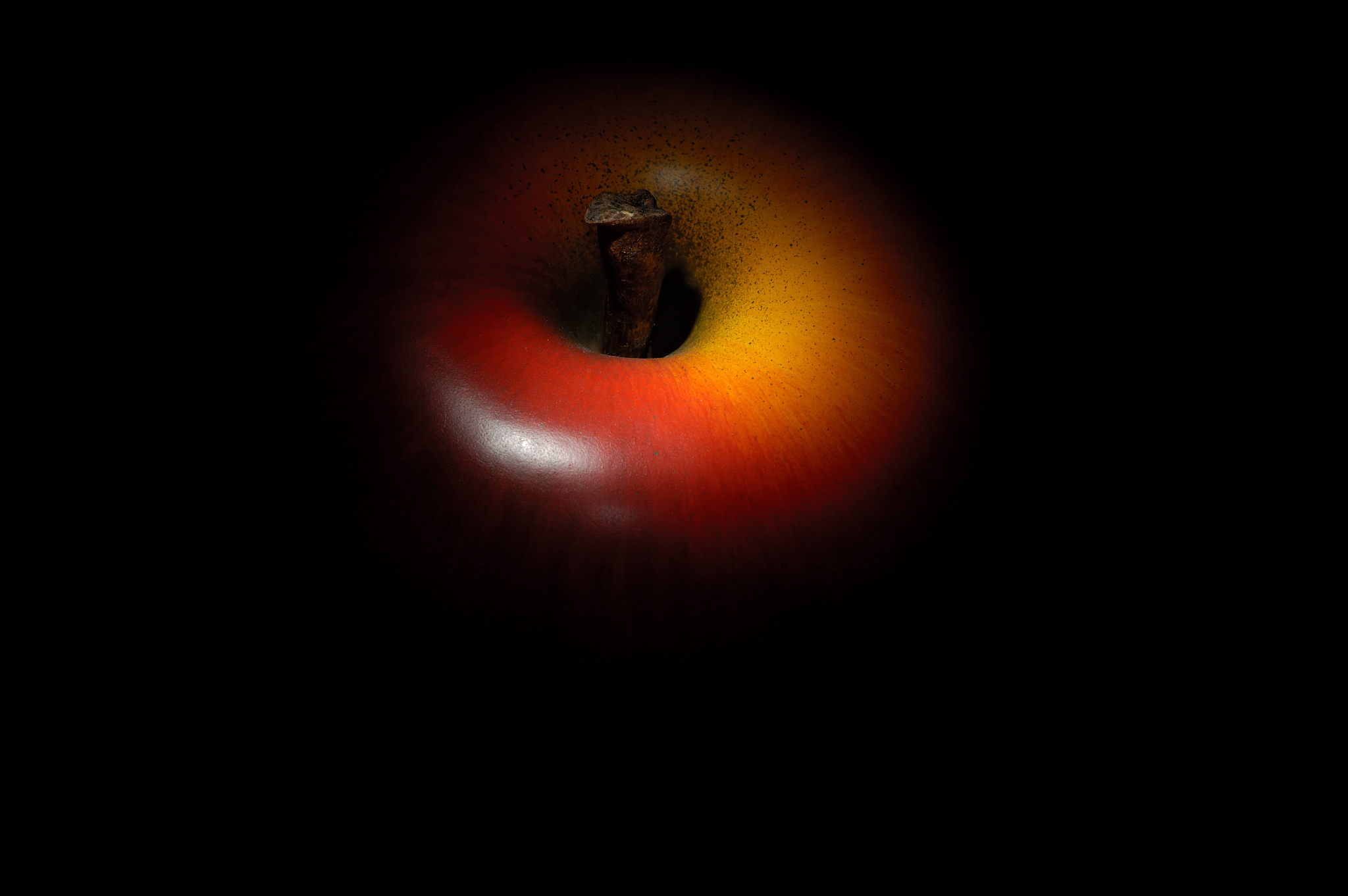 red apple, black background