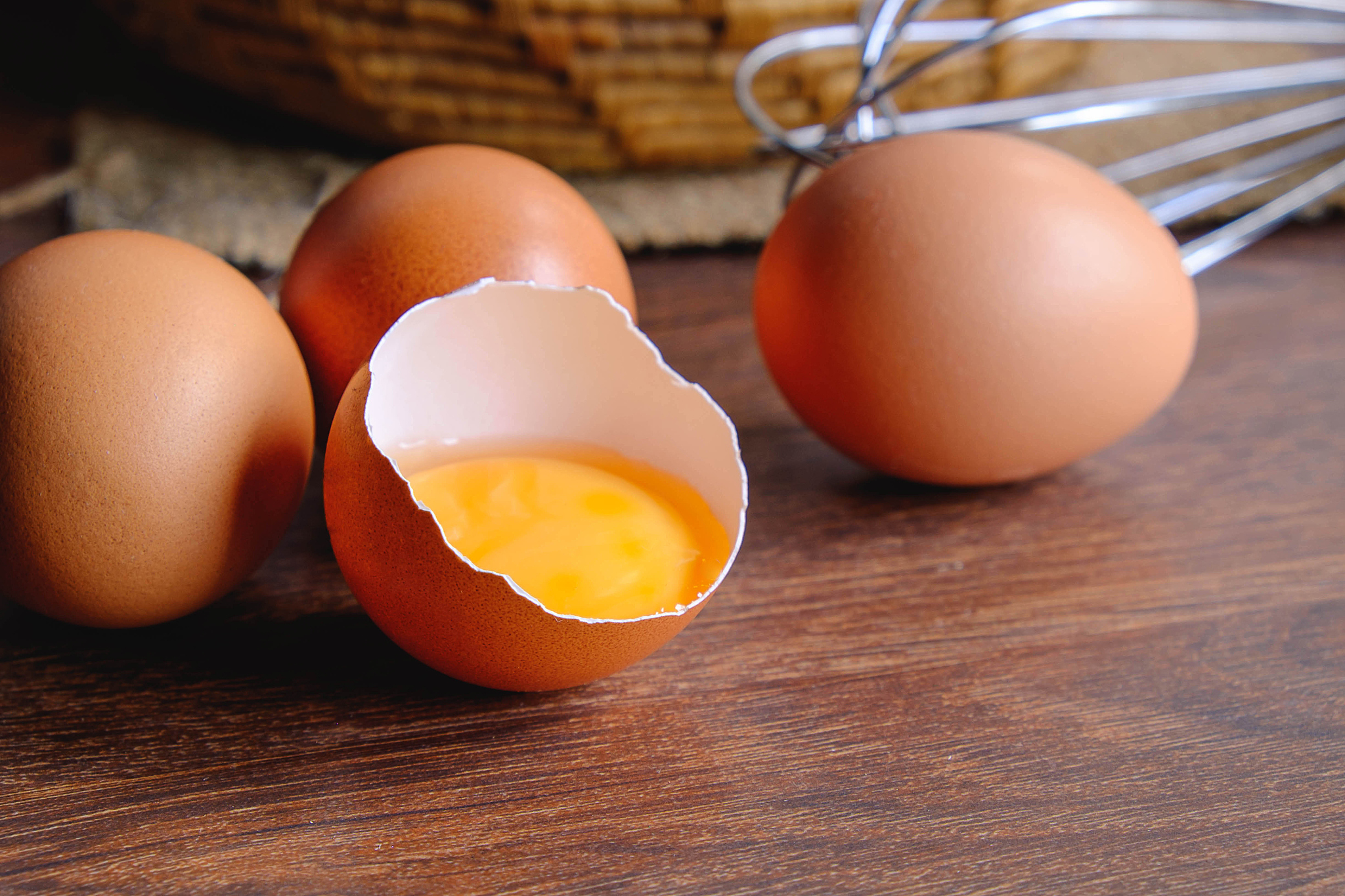 fresh organic chicken eggs in a basket.