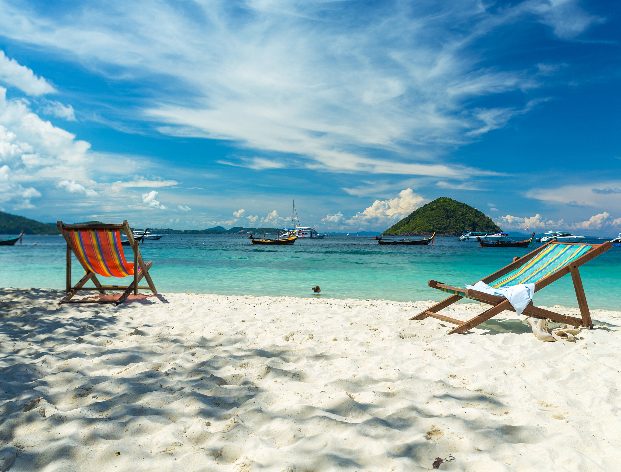 sunbeds on a paradise island, a sunny day on the beach of the re