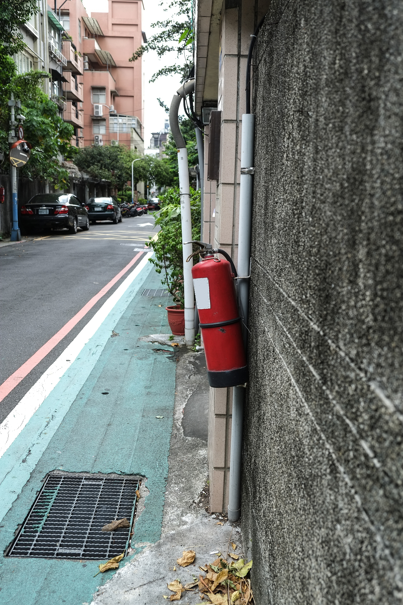 extinguisher in public places. hanging on the wall next to the r