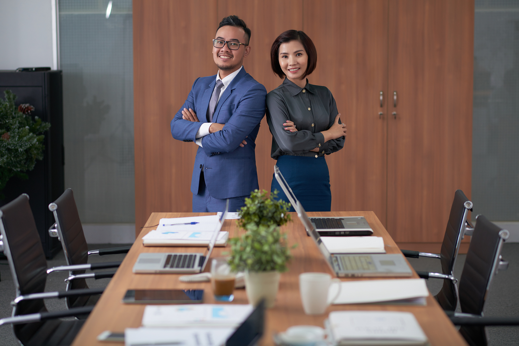 smiling managers posing for photography