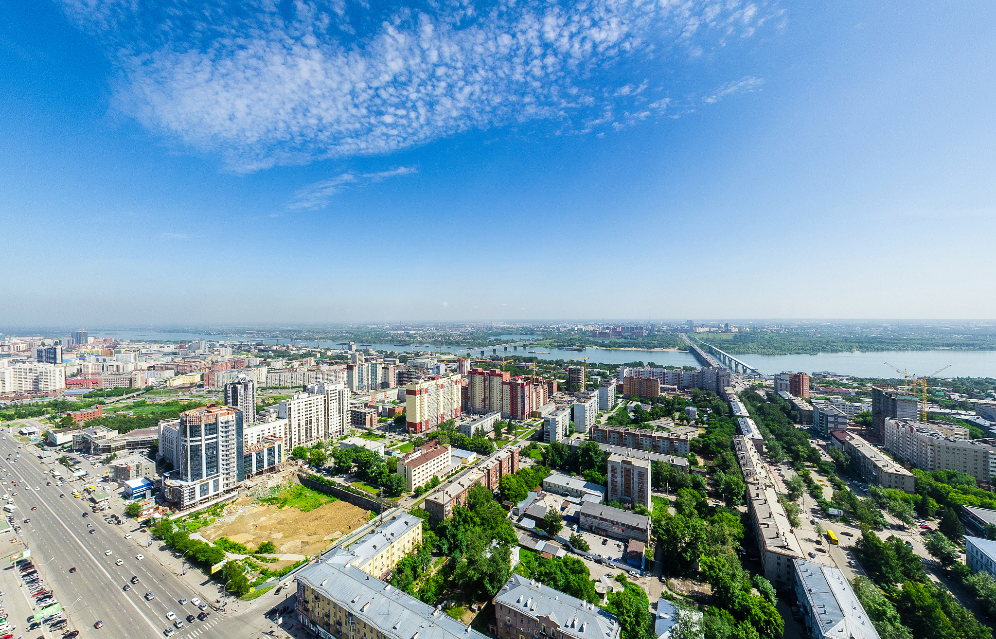 aerial city view with crossroads and roads, houses buildings. co