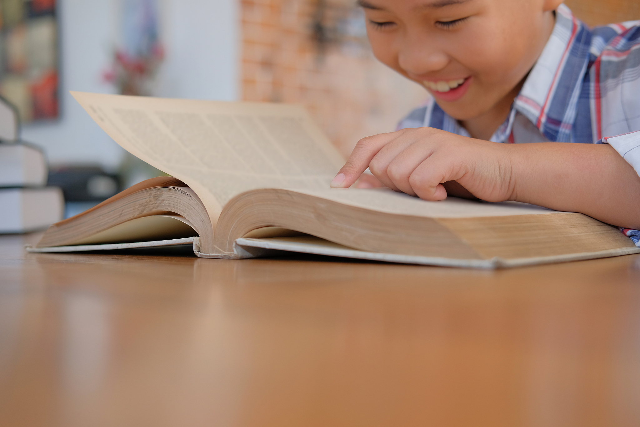 little asian kid boy child children studying reading book.