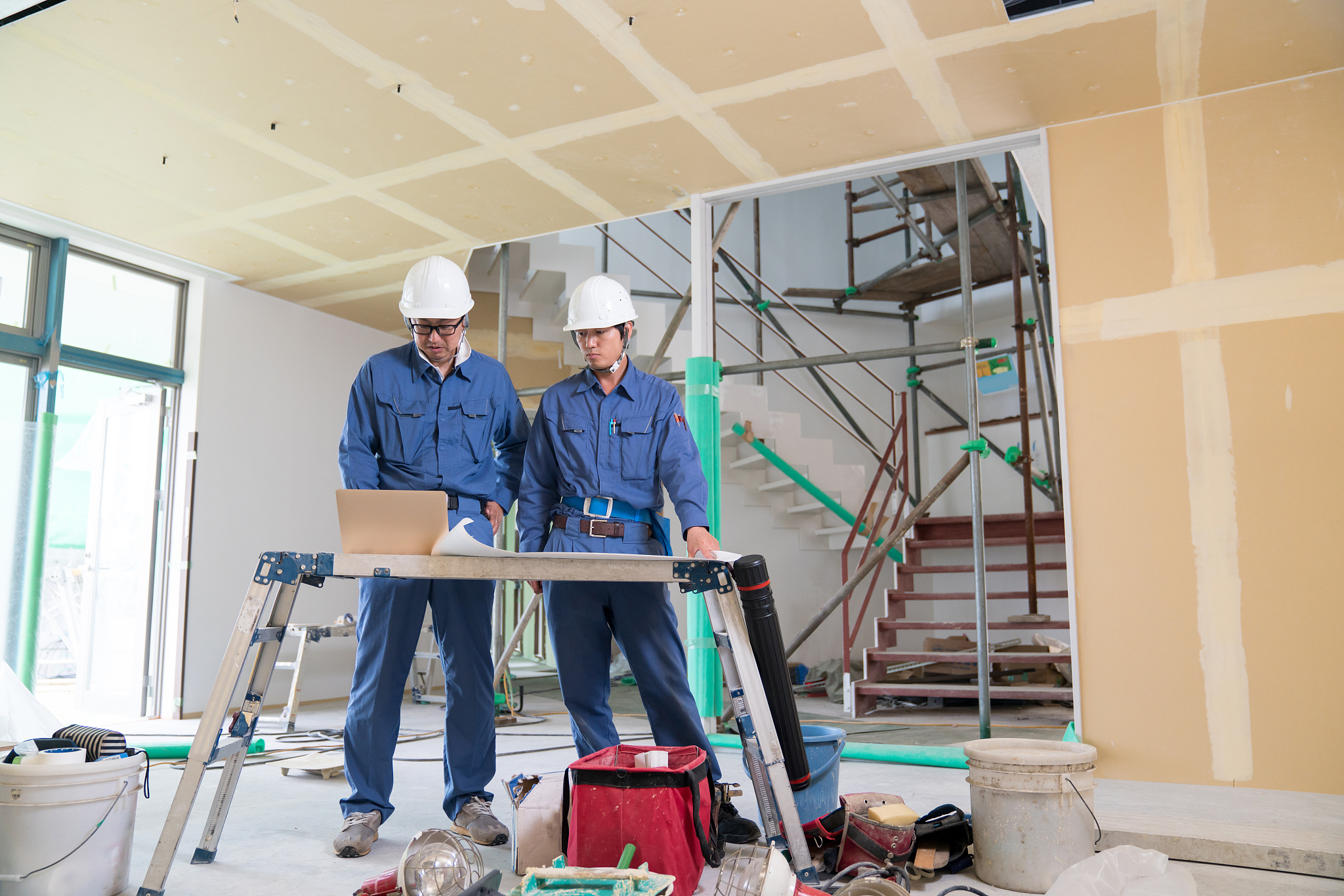 two engineers or architects or inspectors at building constructi