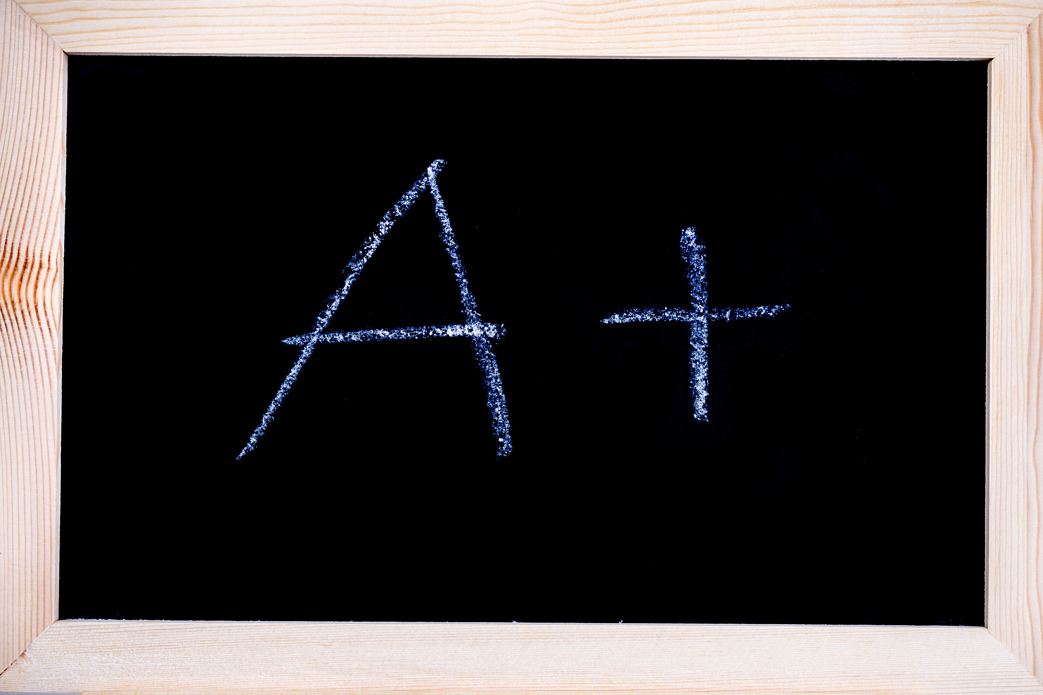 white chalk written on a blackboard