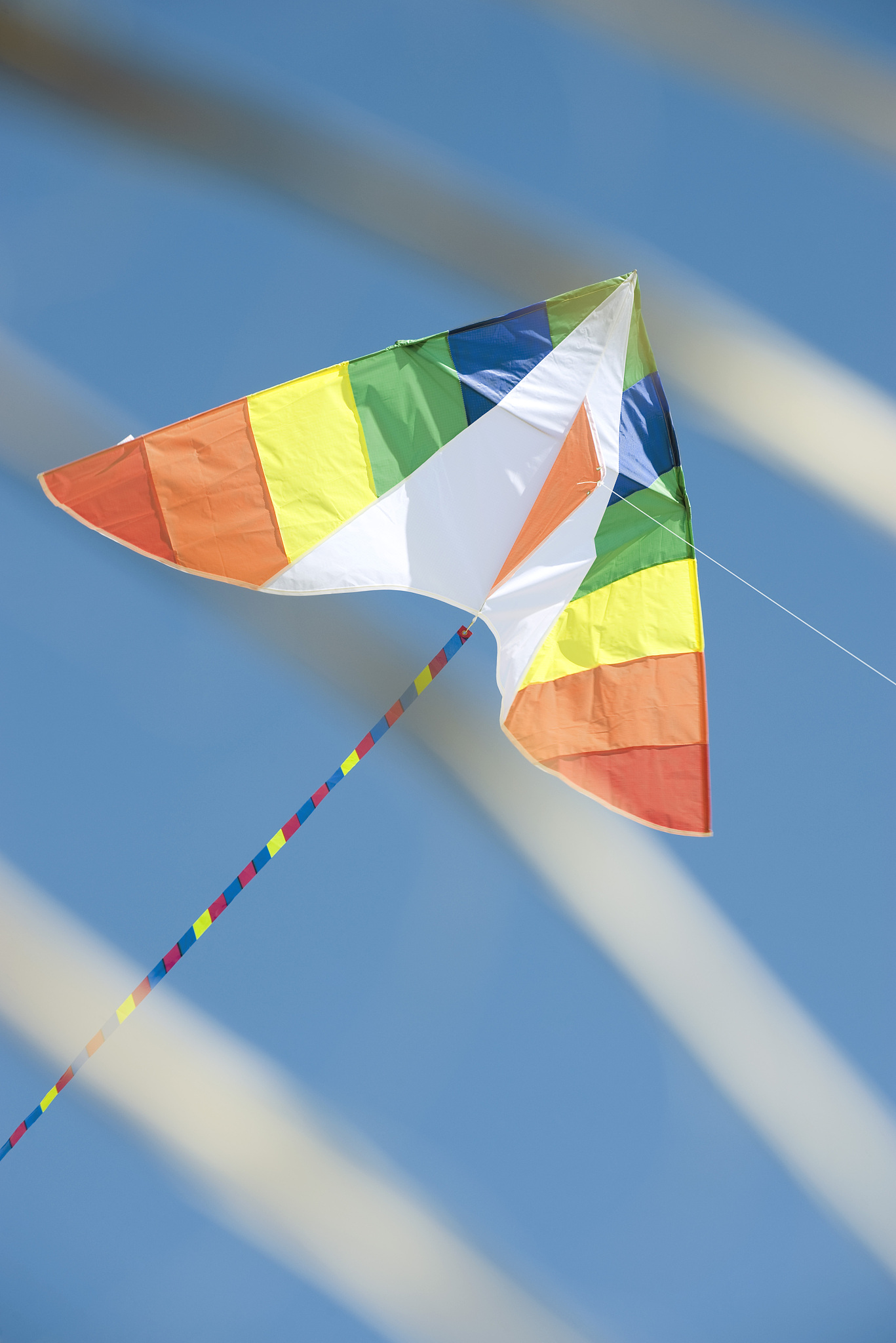 colorful kite in midair, low angle view
