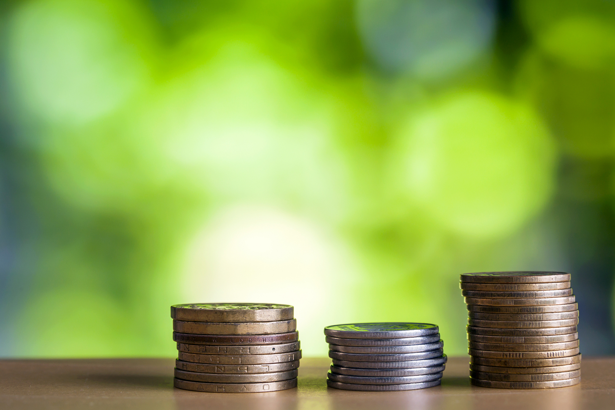 oins stacks with green and blue sparkling bokeh background. fina
