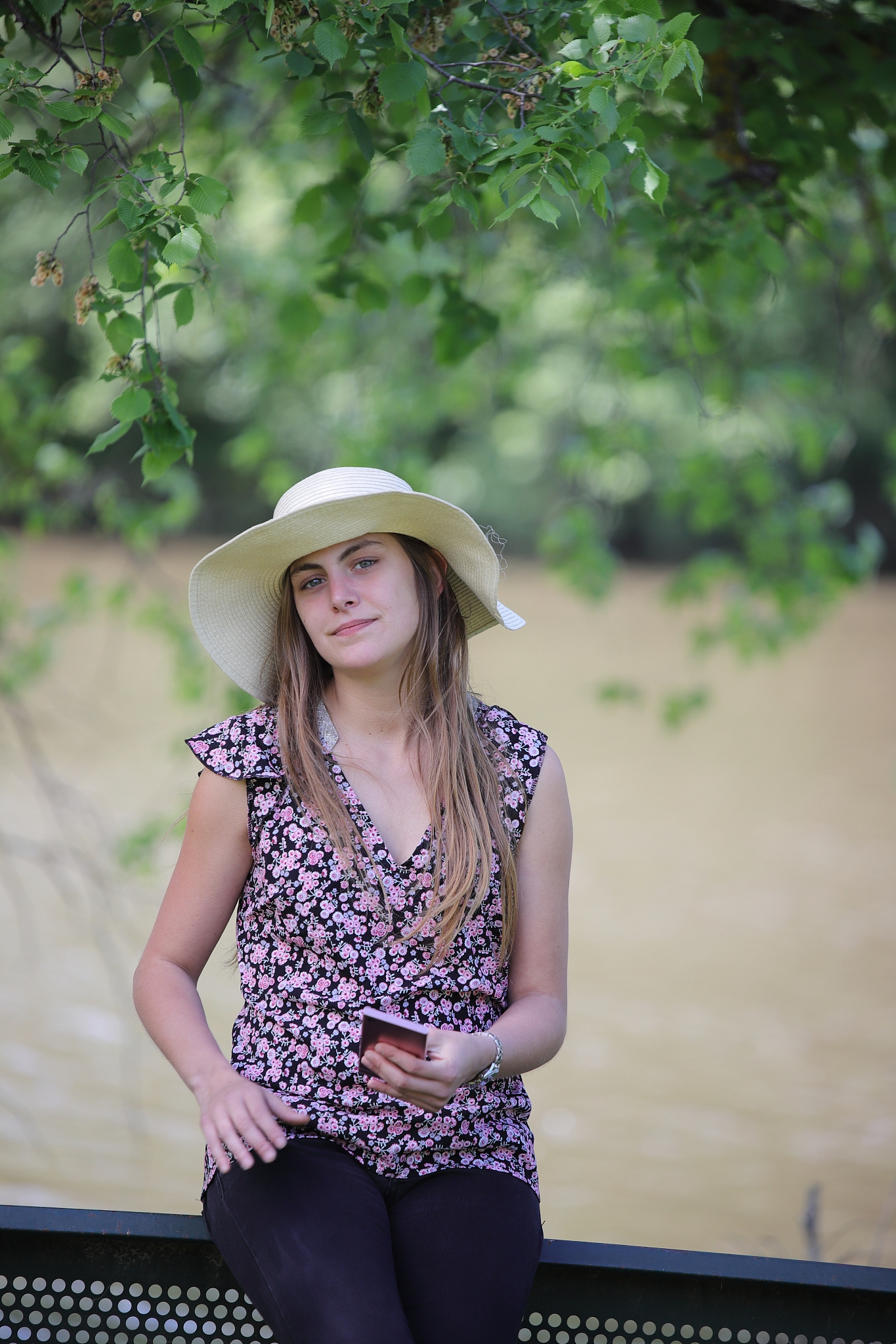 young and pretty woman reading a message on her smartphone