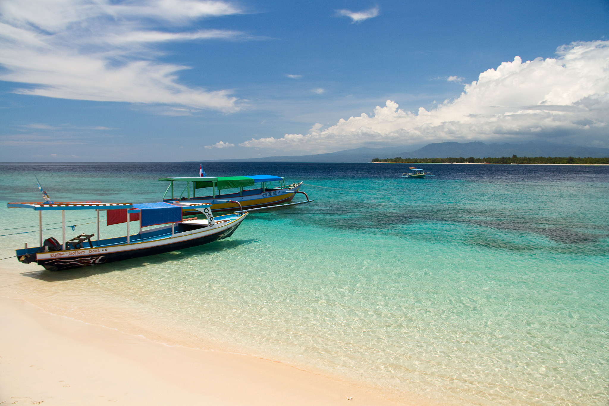 boats on paradise beach and sea on island, gili islands