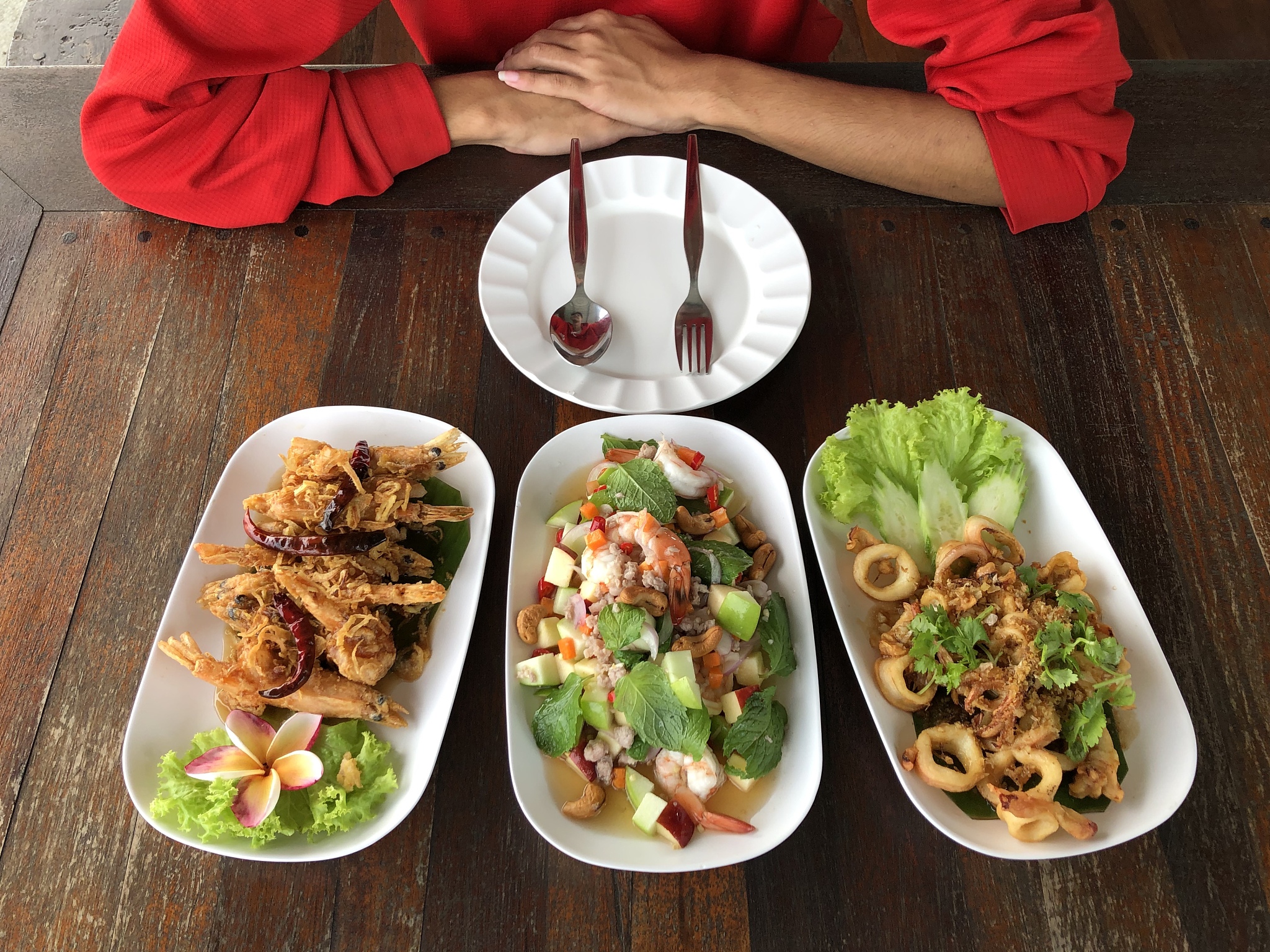 ready to eat : three plates of cooked seafood placed on the wood