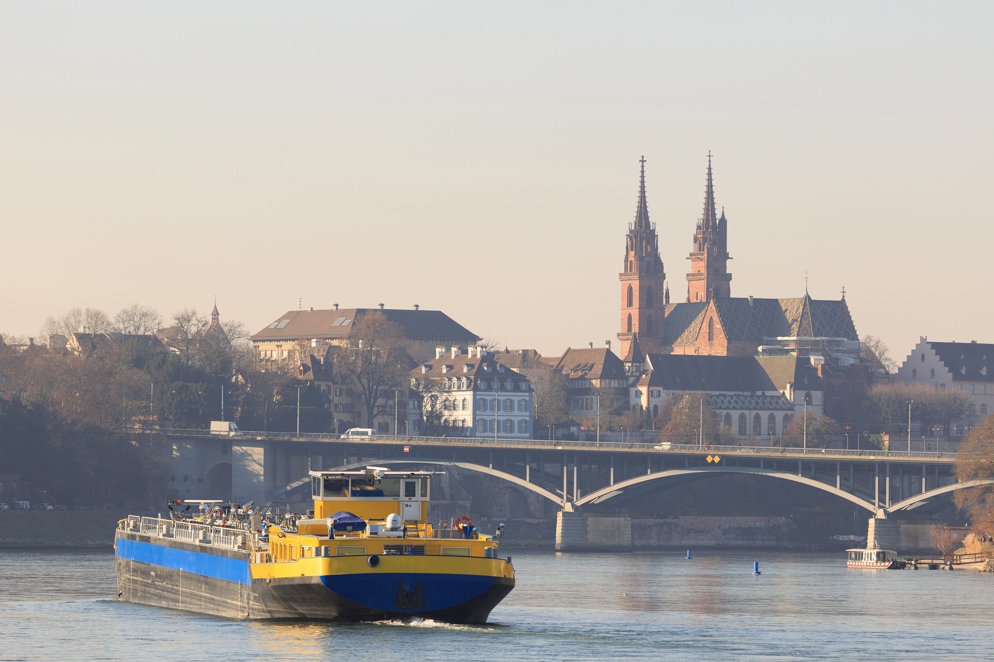 an anonymous cargo ship on the rhine in basel