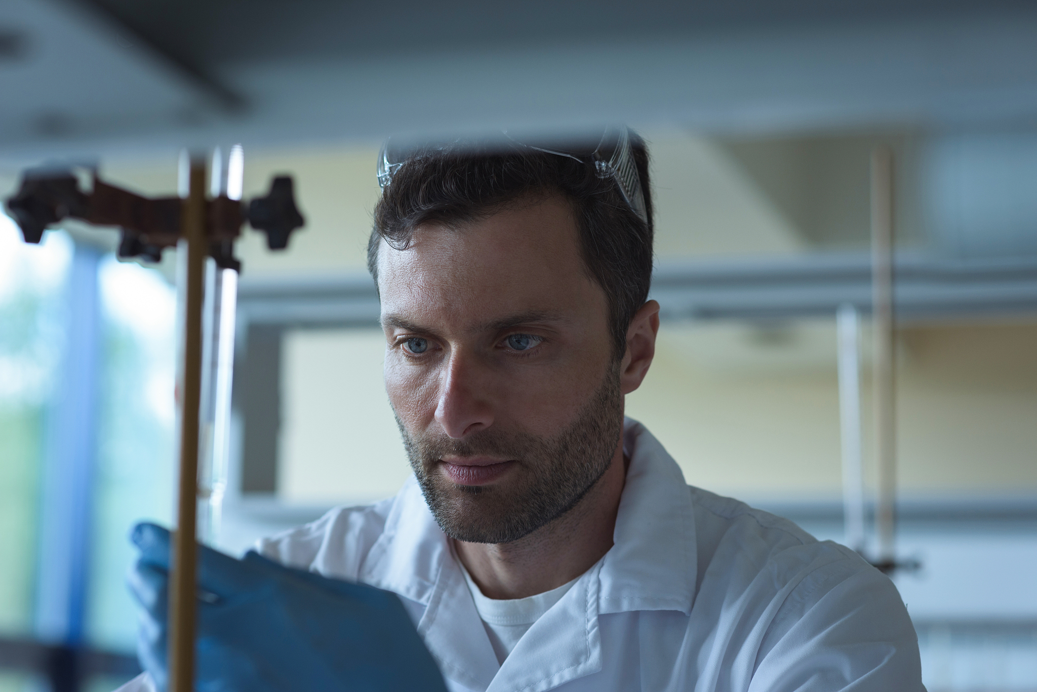 university student doing a chemical experiment in laboratory