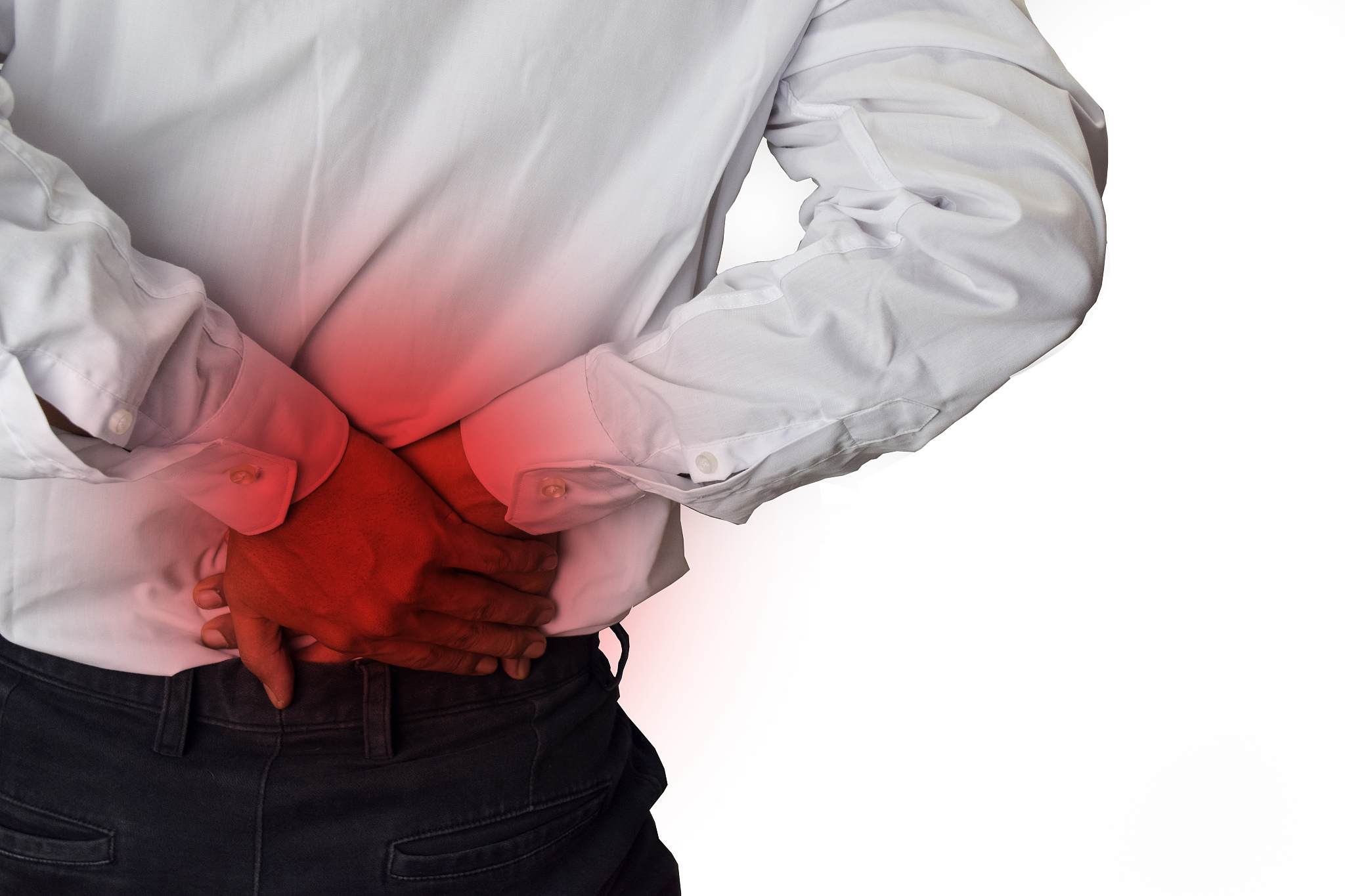 feels pain in the small of the back. back pain, physical injury
