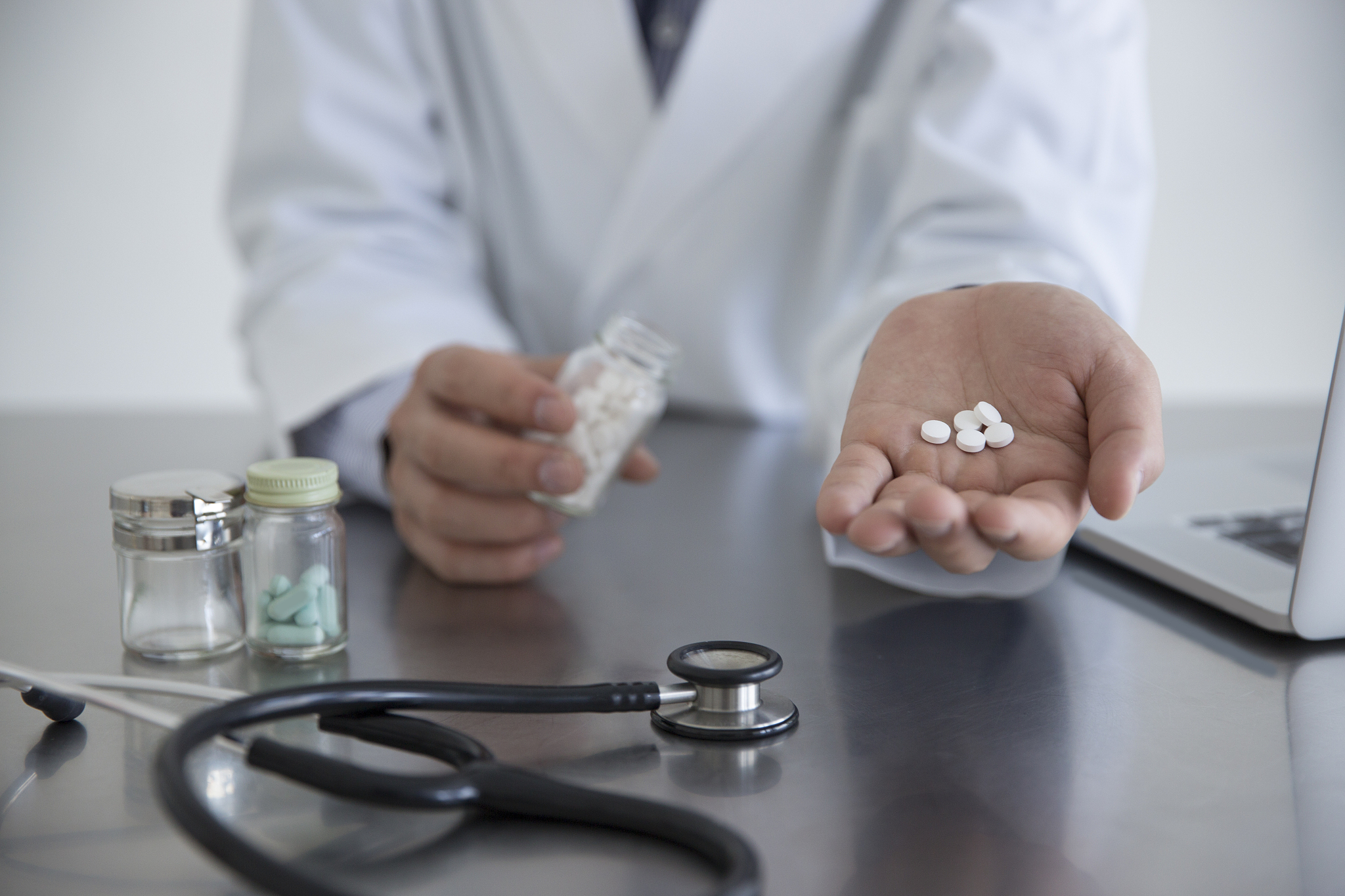 doctor giving medicine to patient