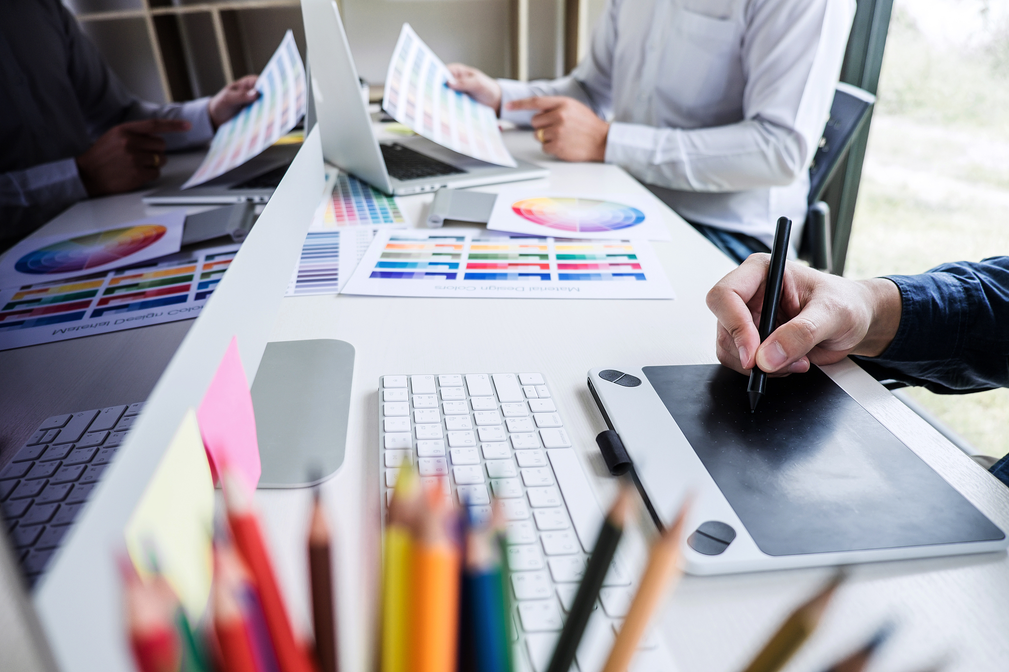 two colleague creative graphic designer working on color selecti