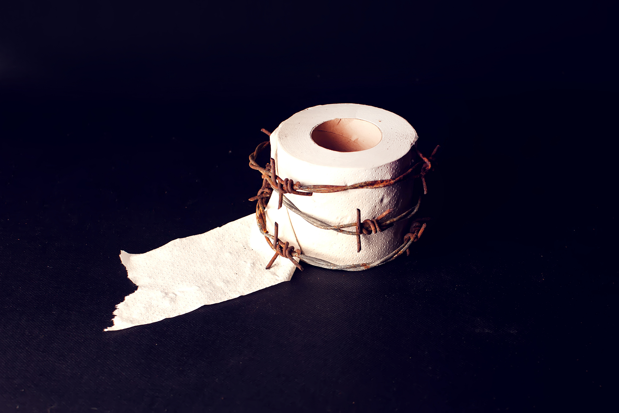 toilet paper with barbed wire around it. people, healthcare and 