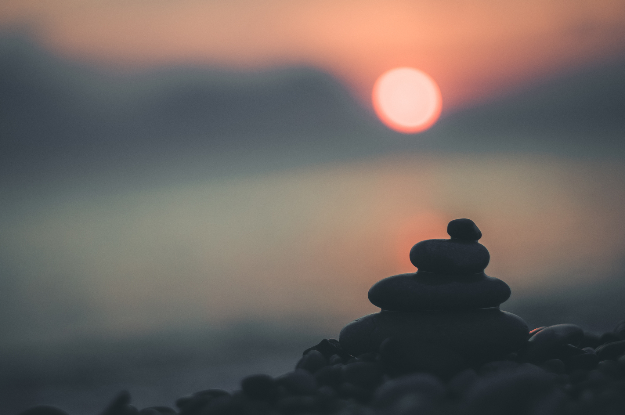 stack of zen stones on pebble beach