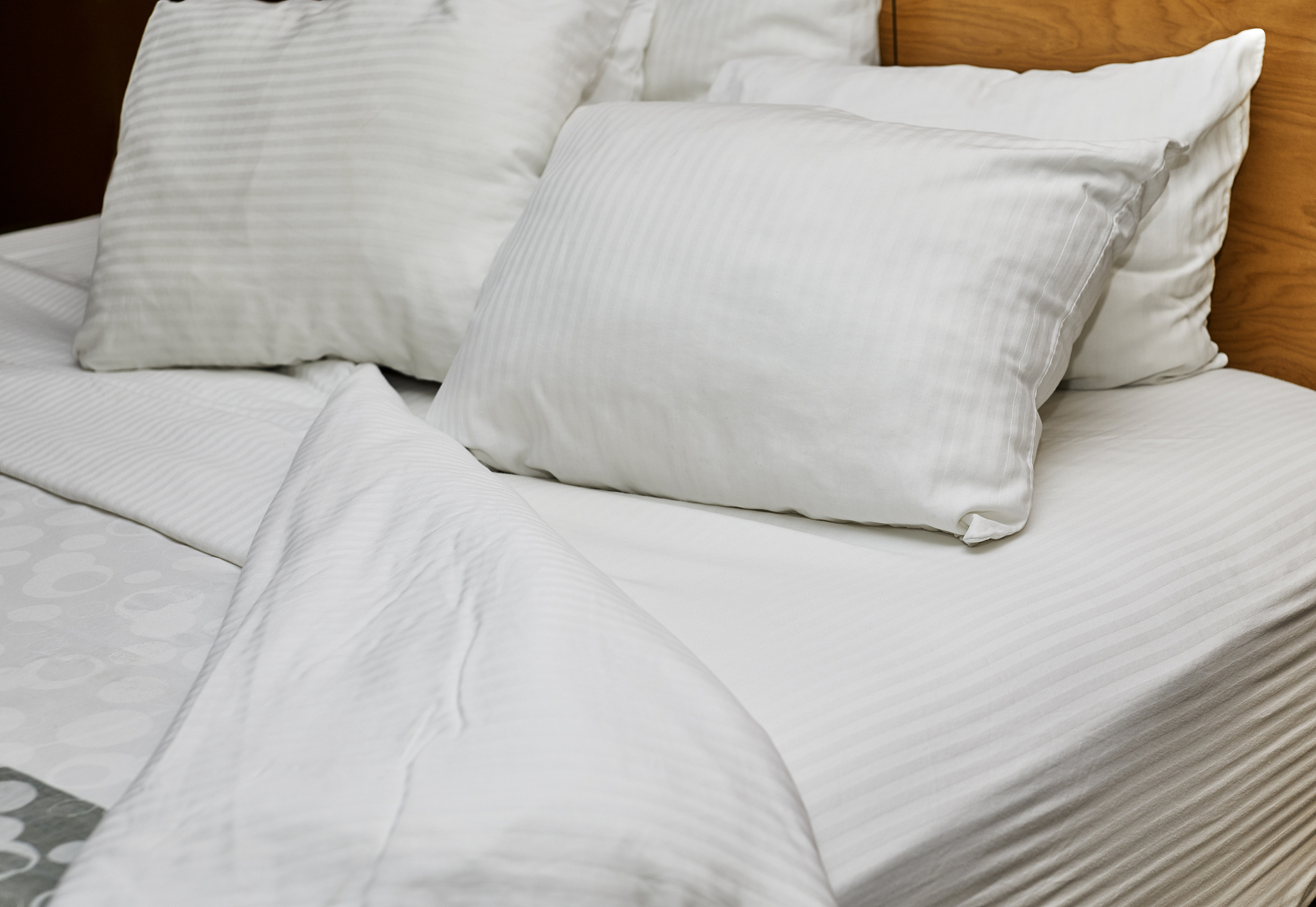 white down pillows on a bed