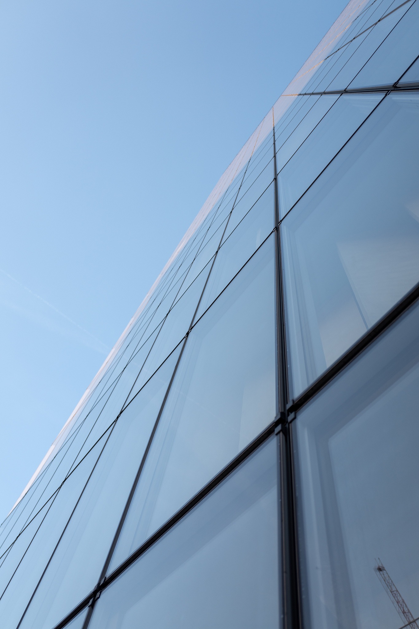low angle view of modern building against clear blue sky