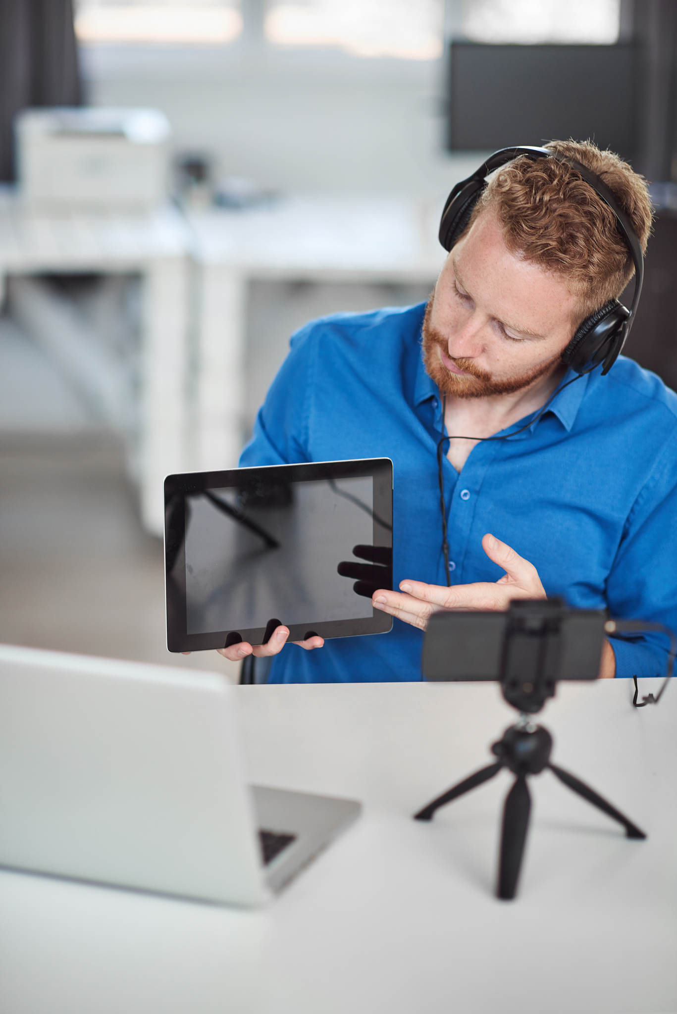 businessman having video call and showing tablet.