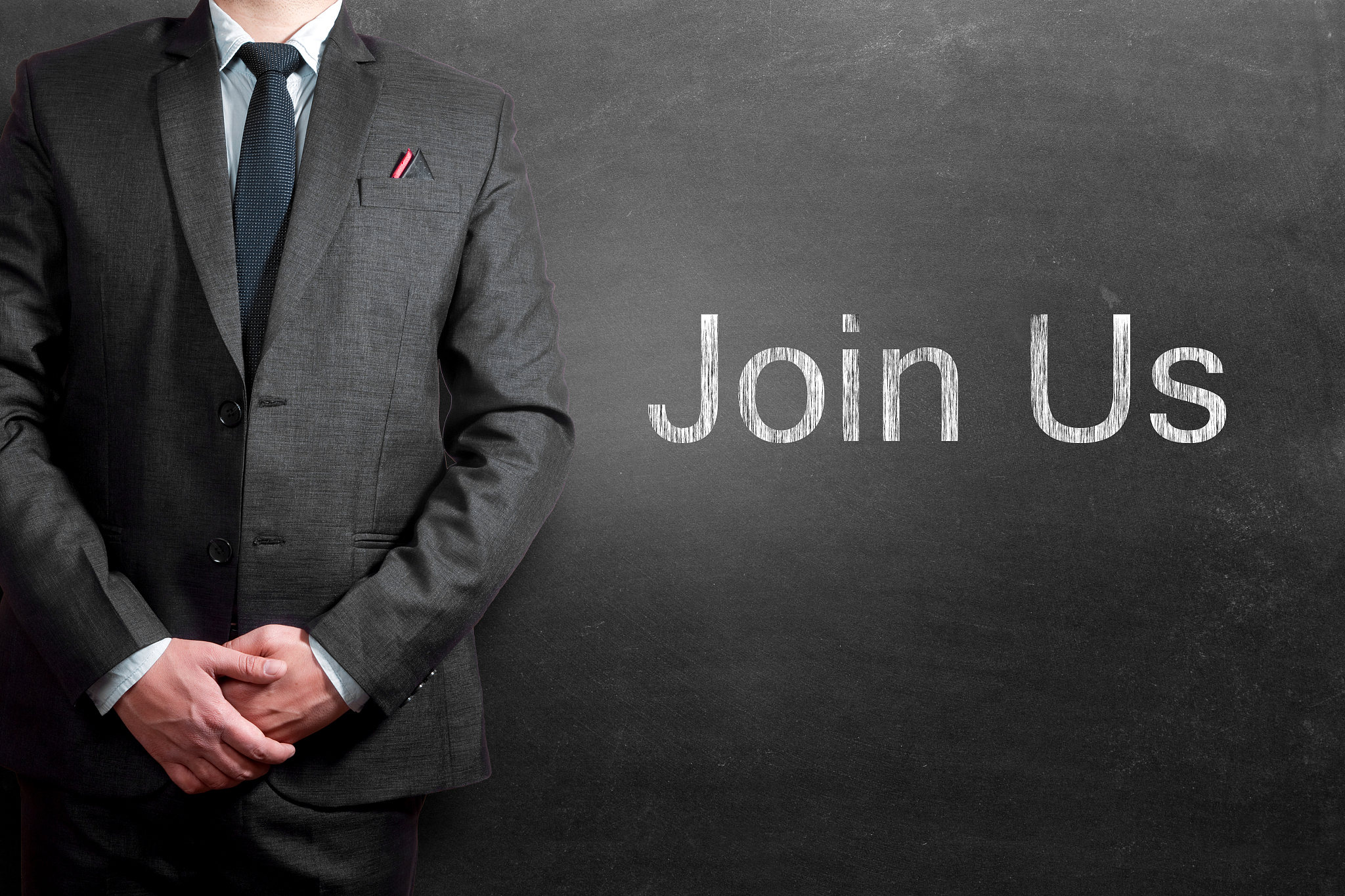 join us words written on blackboard with businessman standing