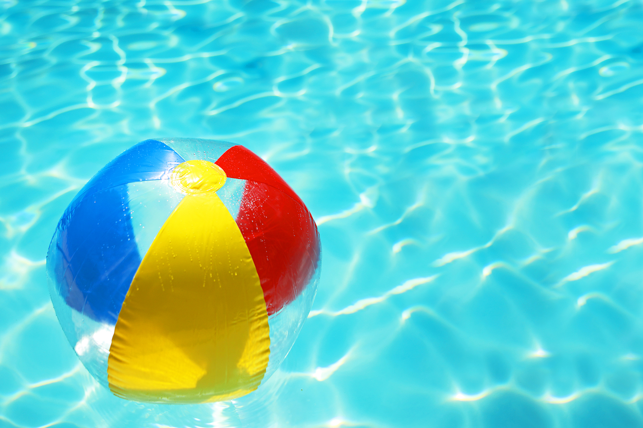 colorful beach ball in a swimming pool