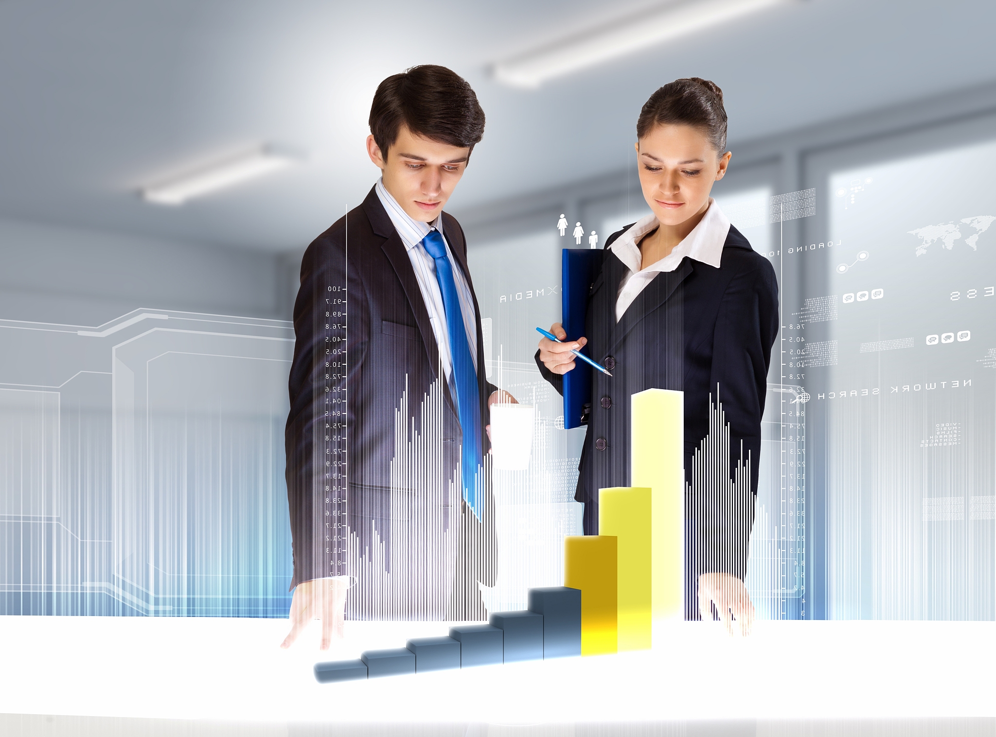 young businesspeople looking at graph of high-tech image
