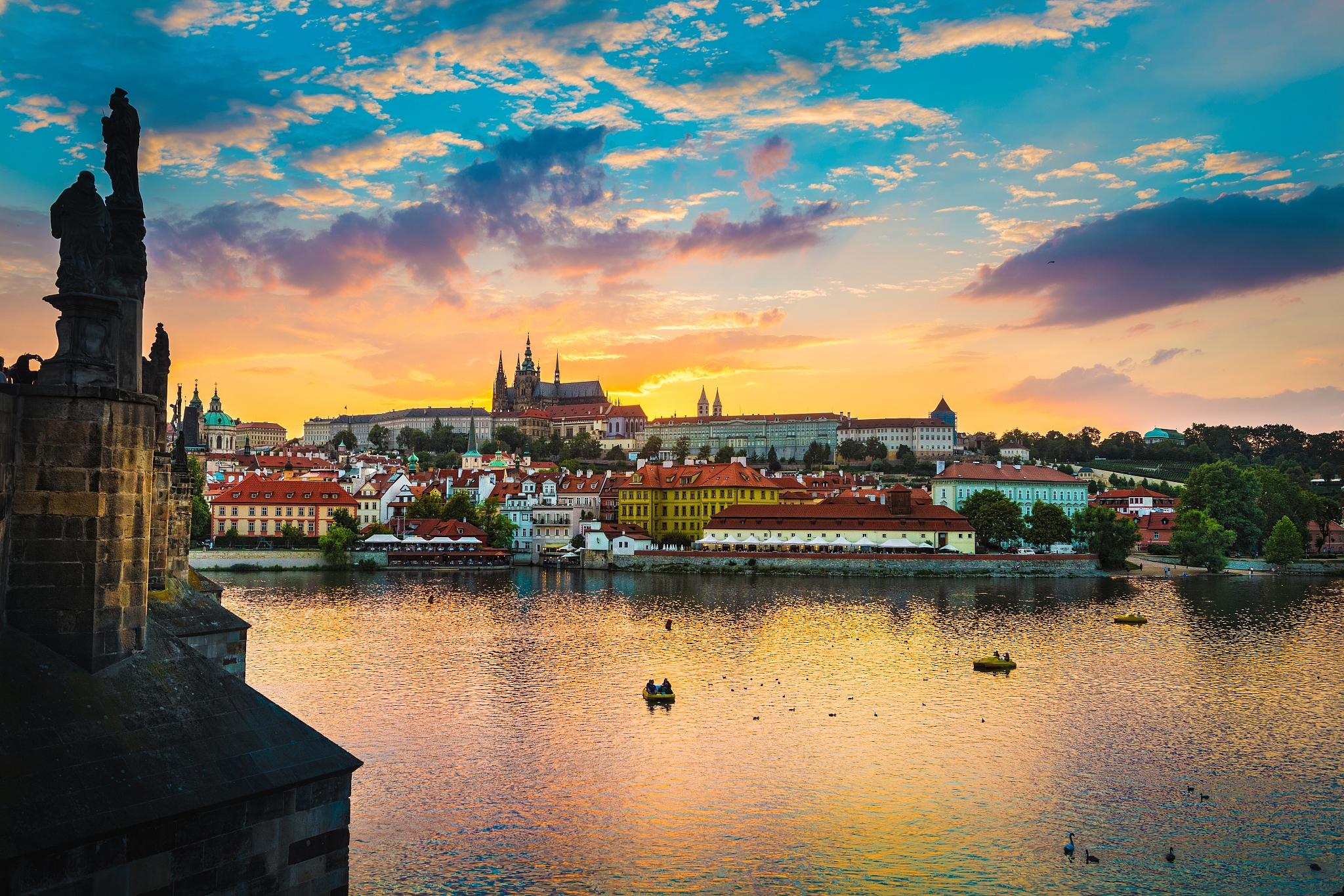 view of charles bridge in prague during sunset, river vltava cze