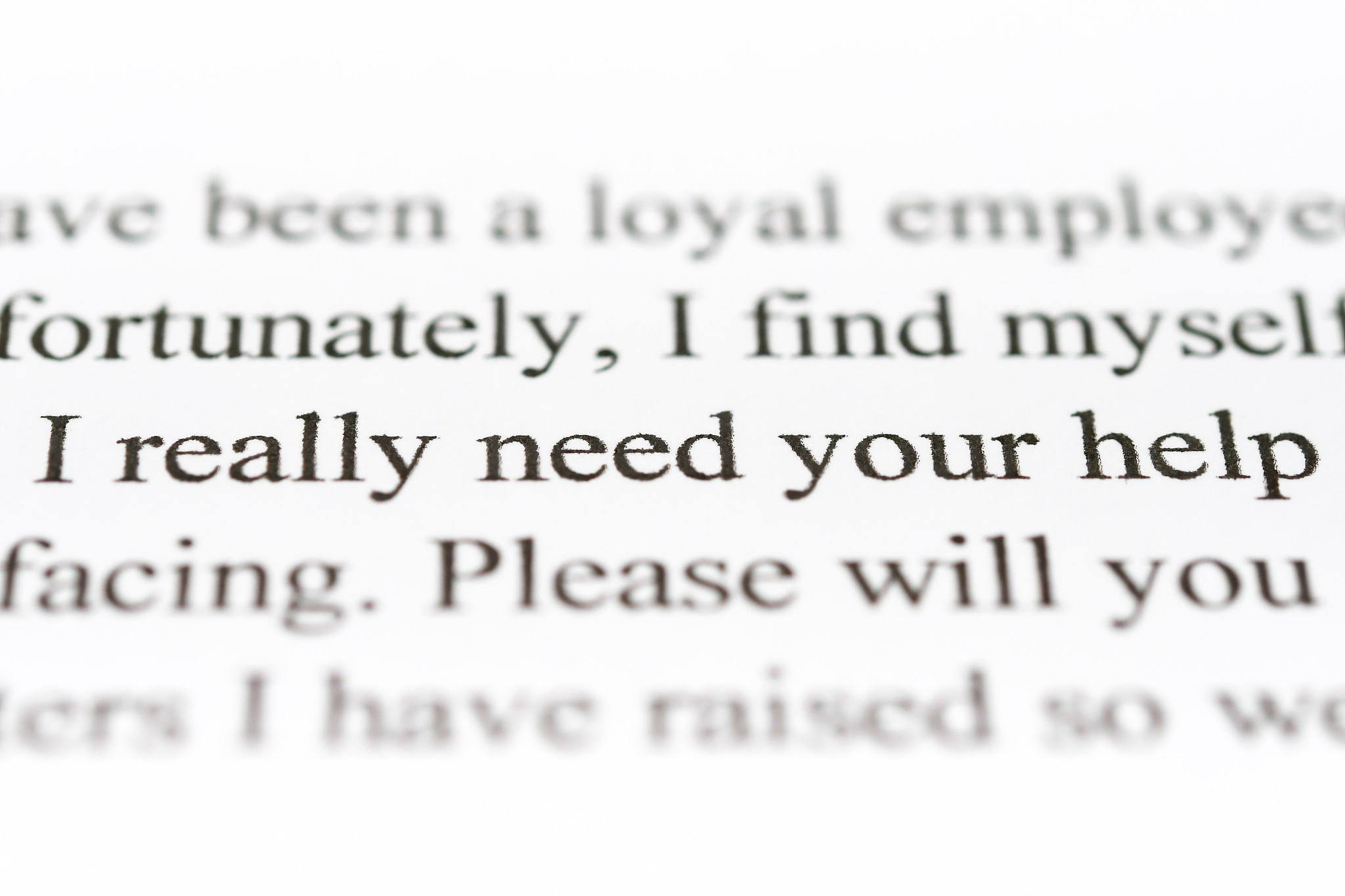 close up of text in letter with a plea for help