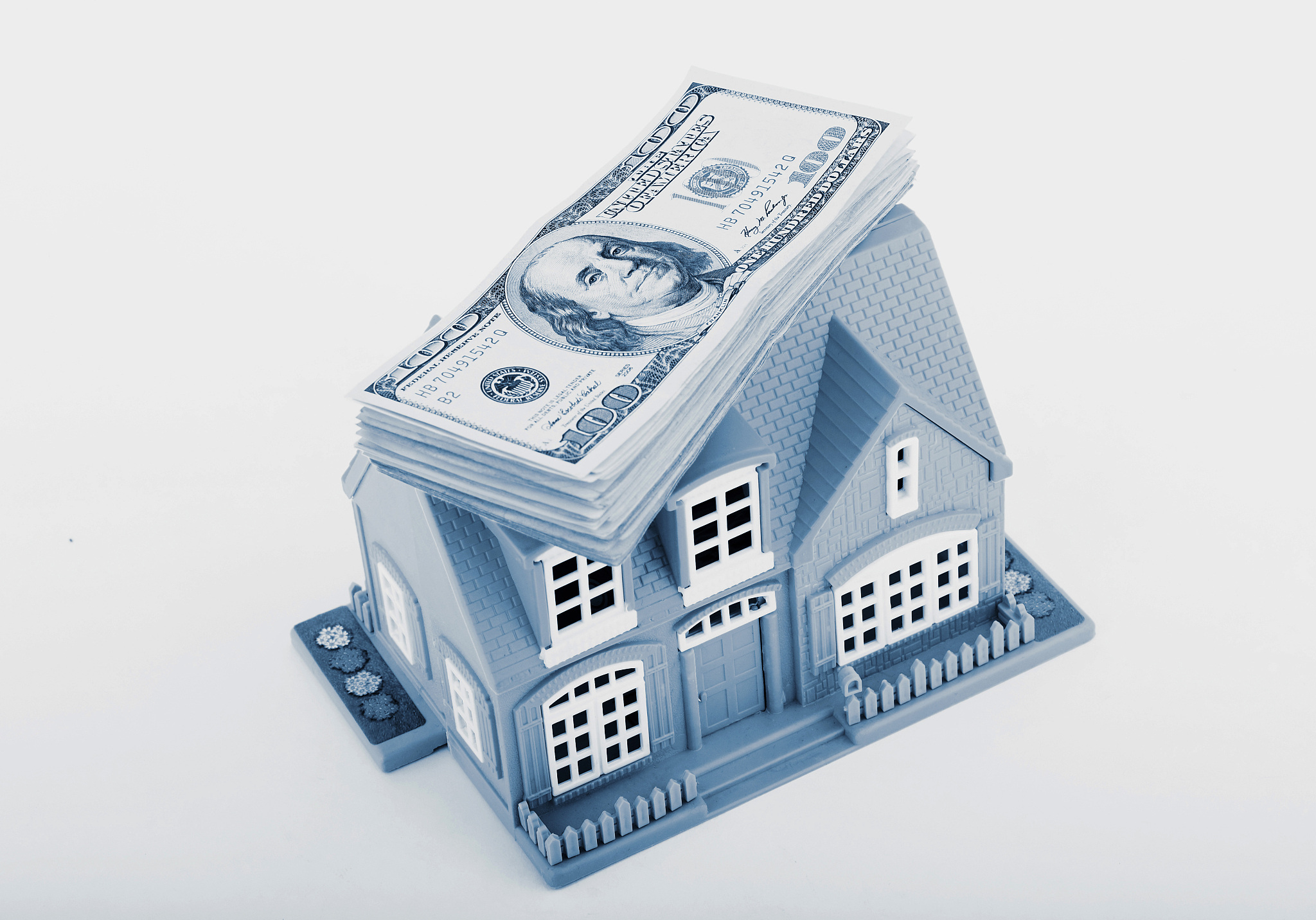 moneys on miniature house