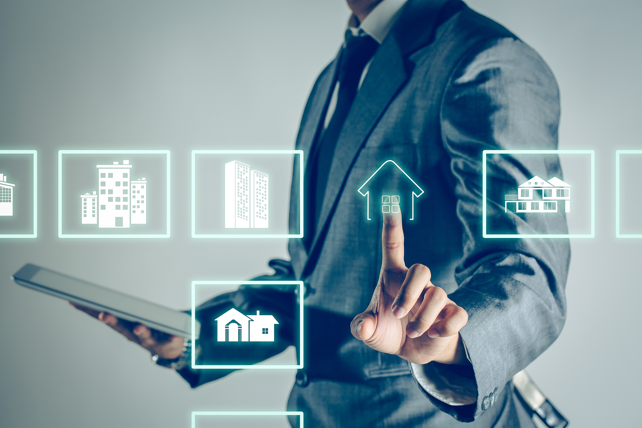 businessman is shopping online to choose a home property to buy 