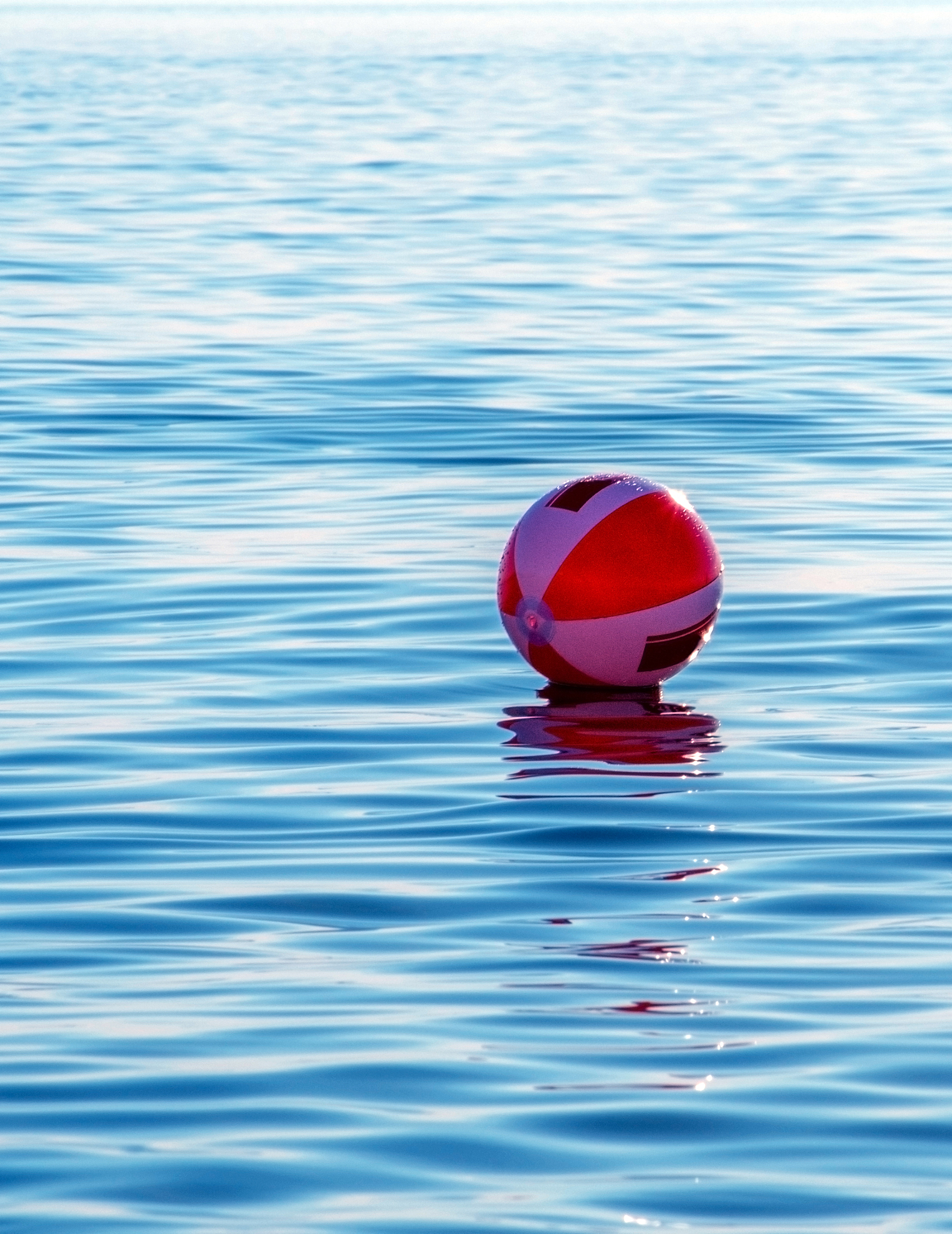 red ball floating in swimming pool