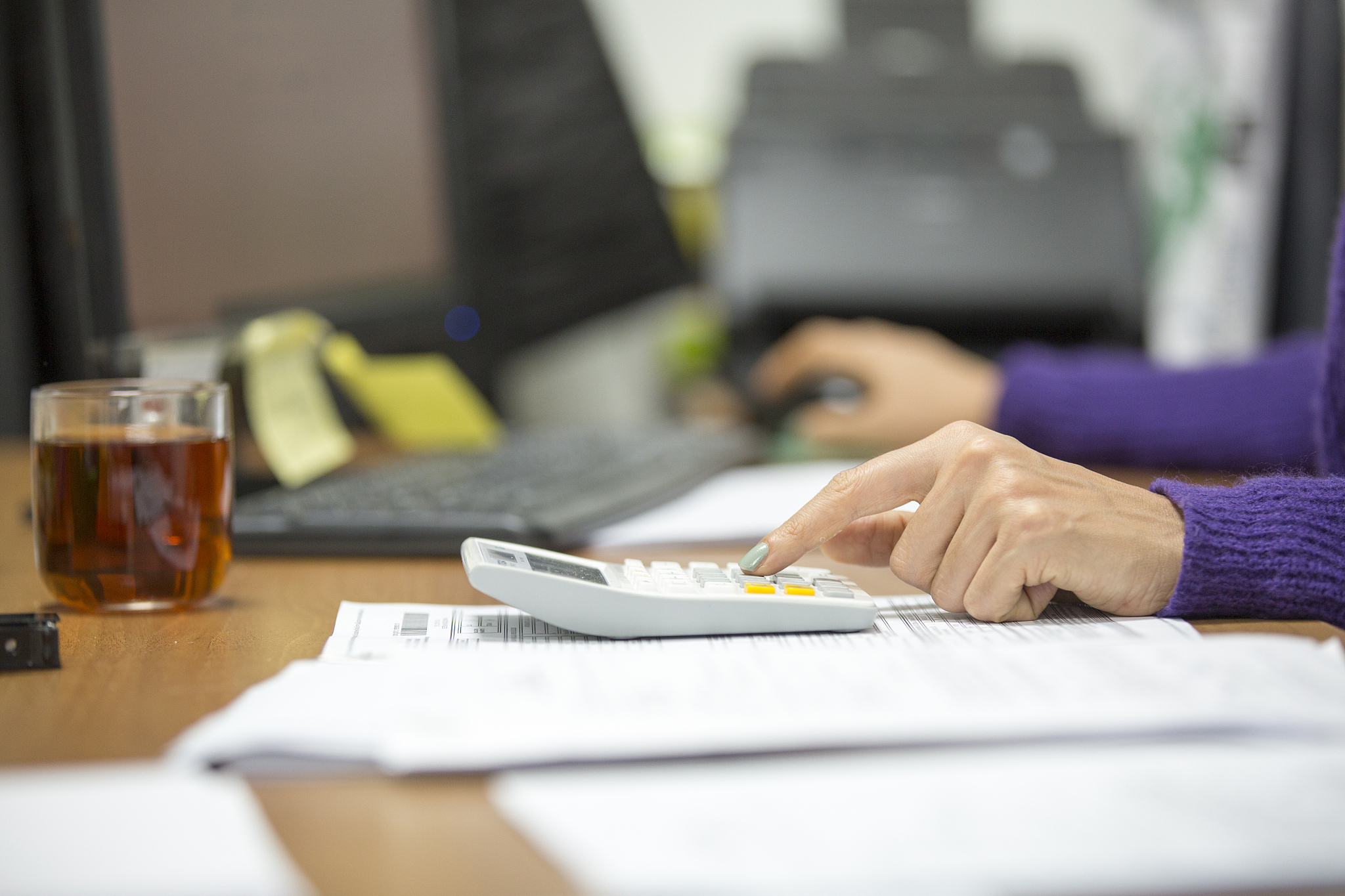 young woman working in an office. savings, finances and economy 
