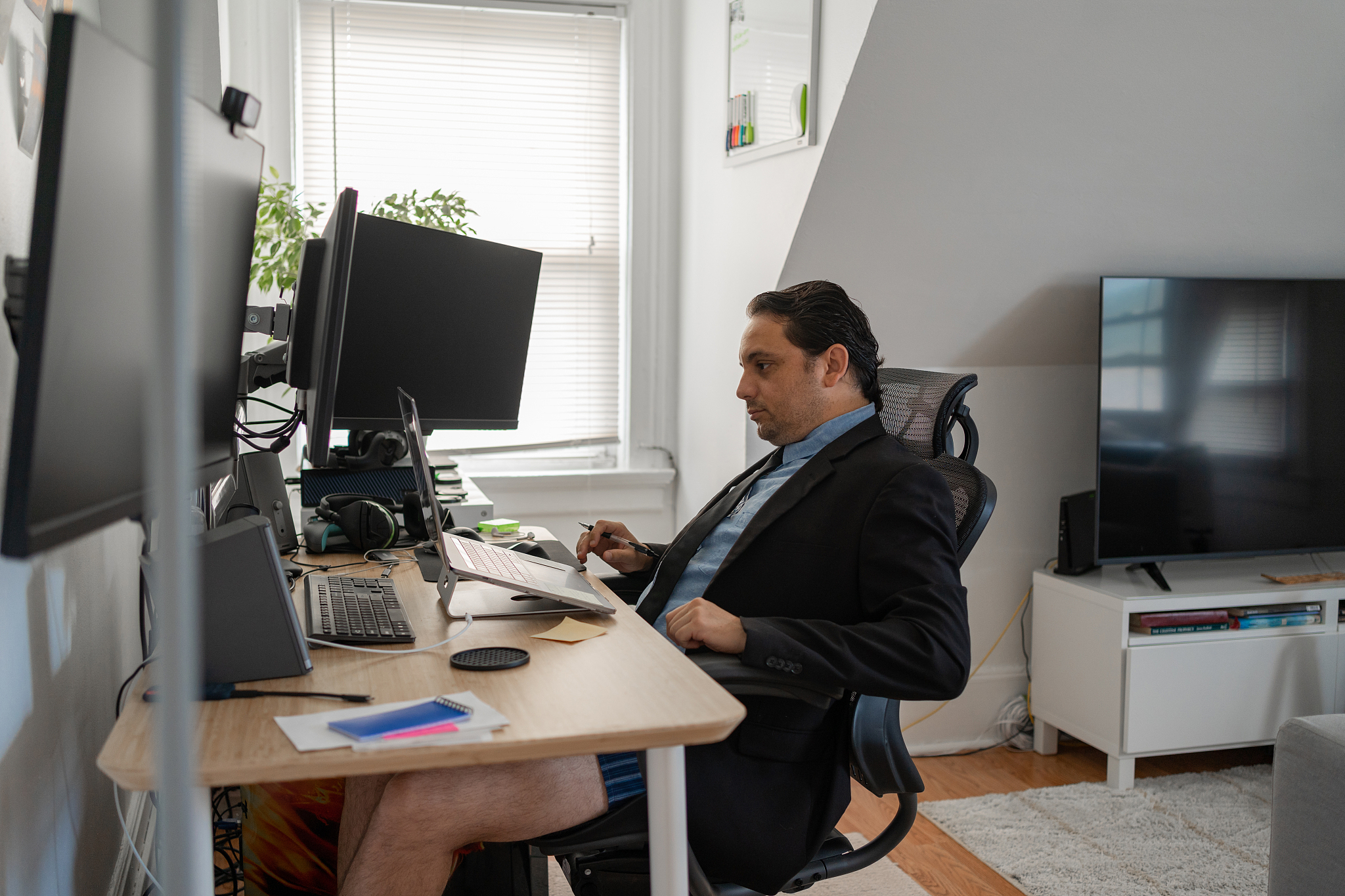 man working from home using computer