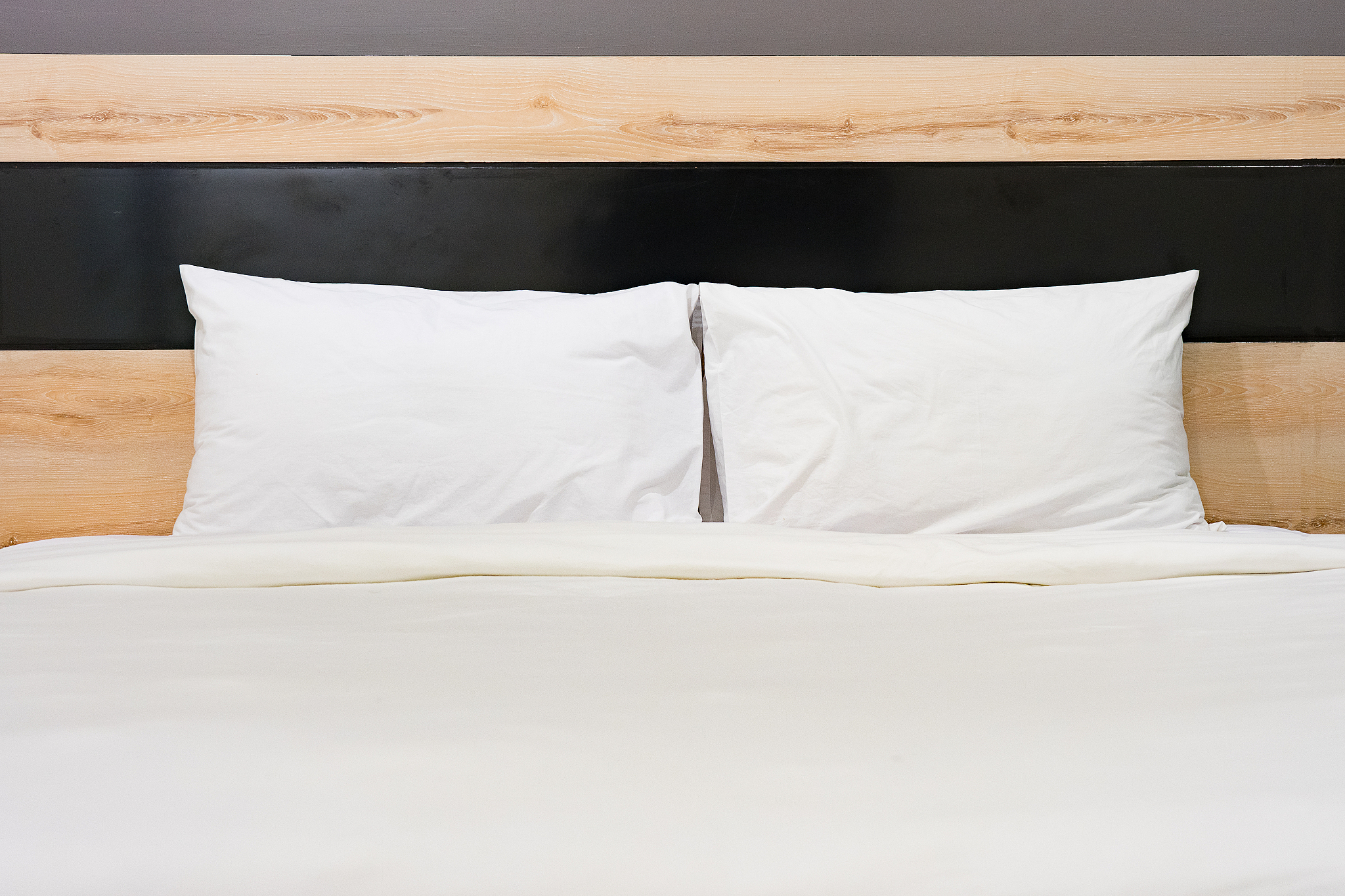 big comfortable double bed in elegant classic bedroom,hotel